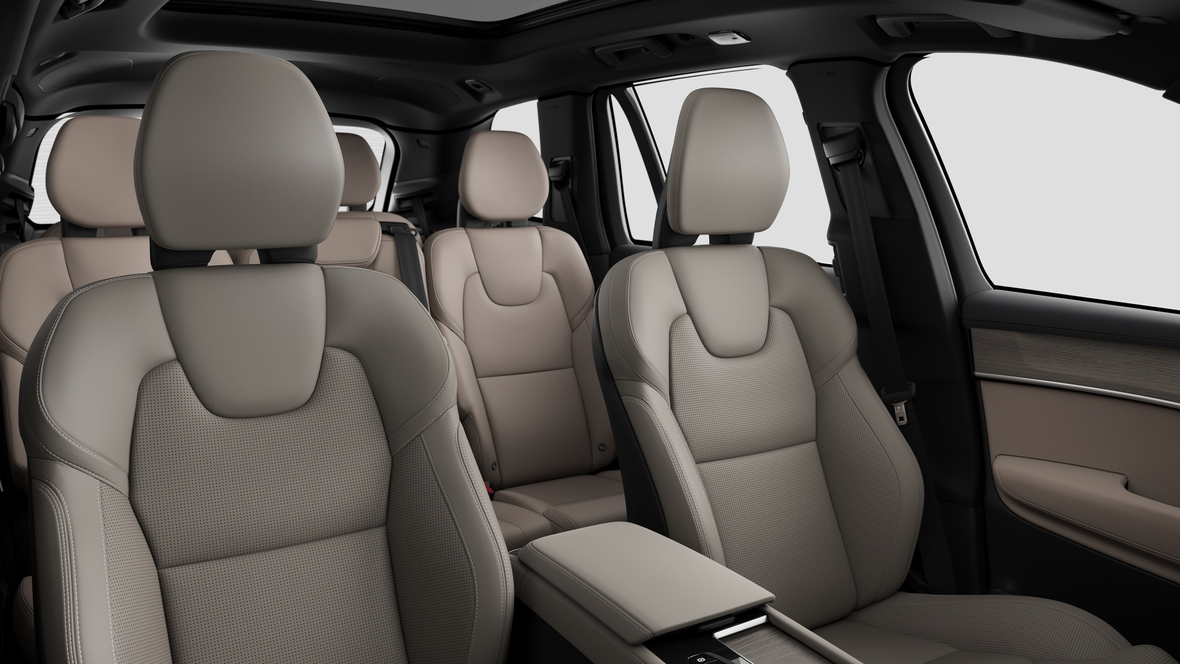 Volvo car interior showing rear passenger seats and center console in plain studio background.