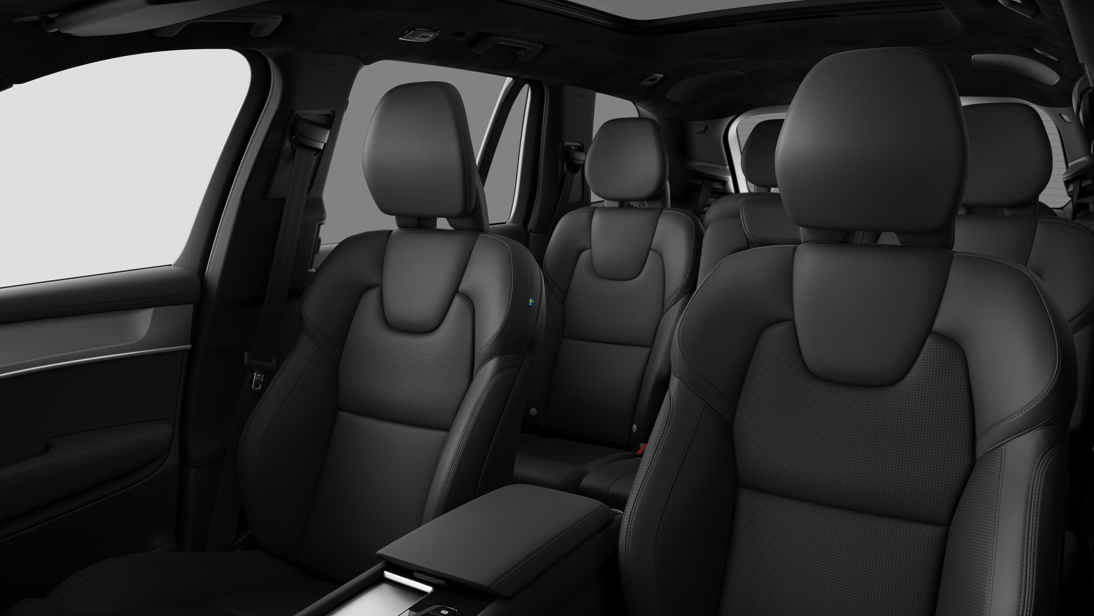 Volvo car interior showing rear passenger seats and center console in plain studio background.