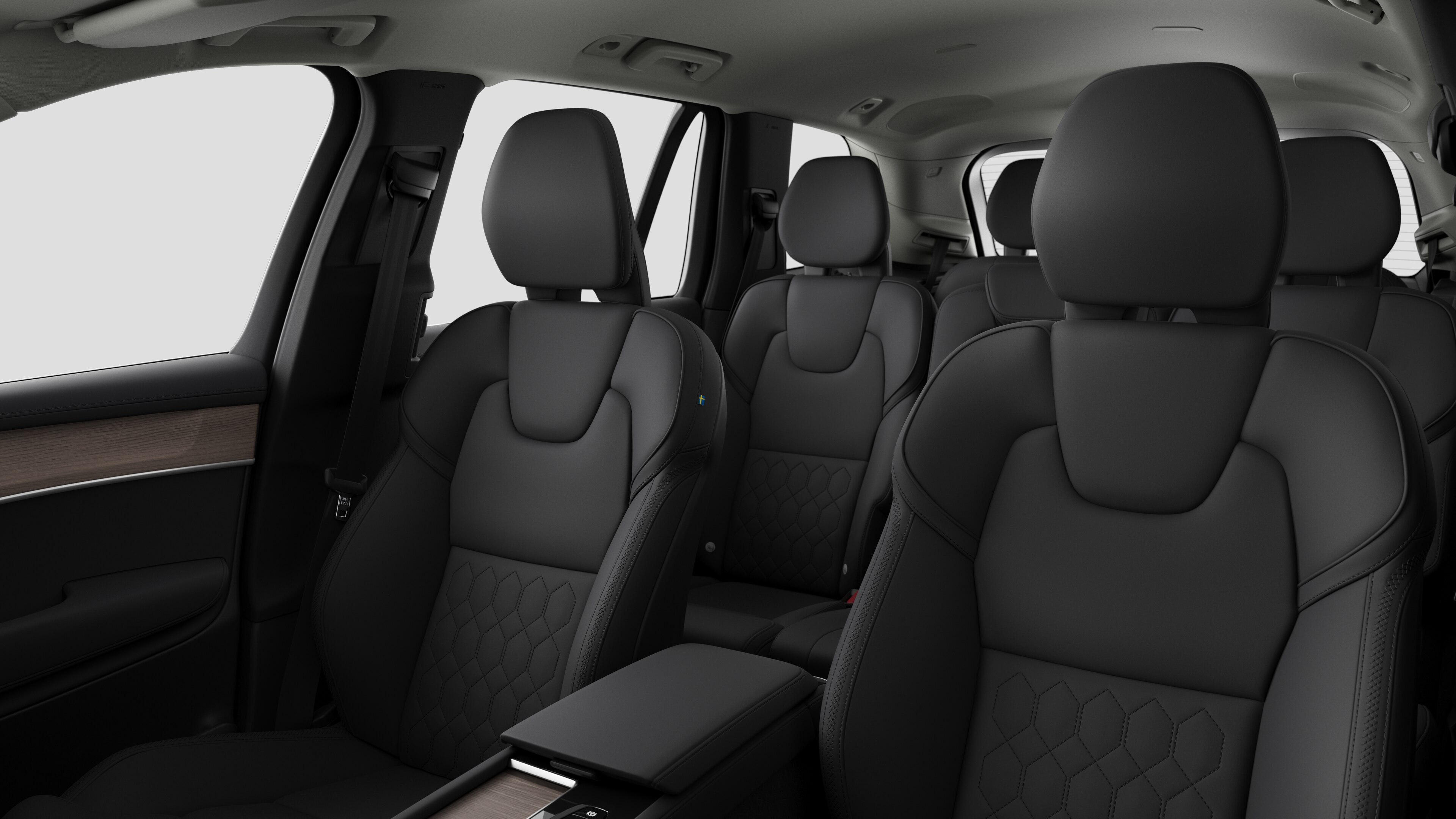 Interiør i en Volvo med bakseter og midtkonsoll i vanlig studiobakgrunn.