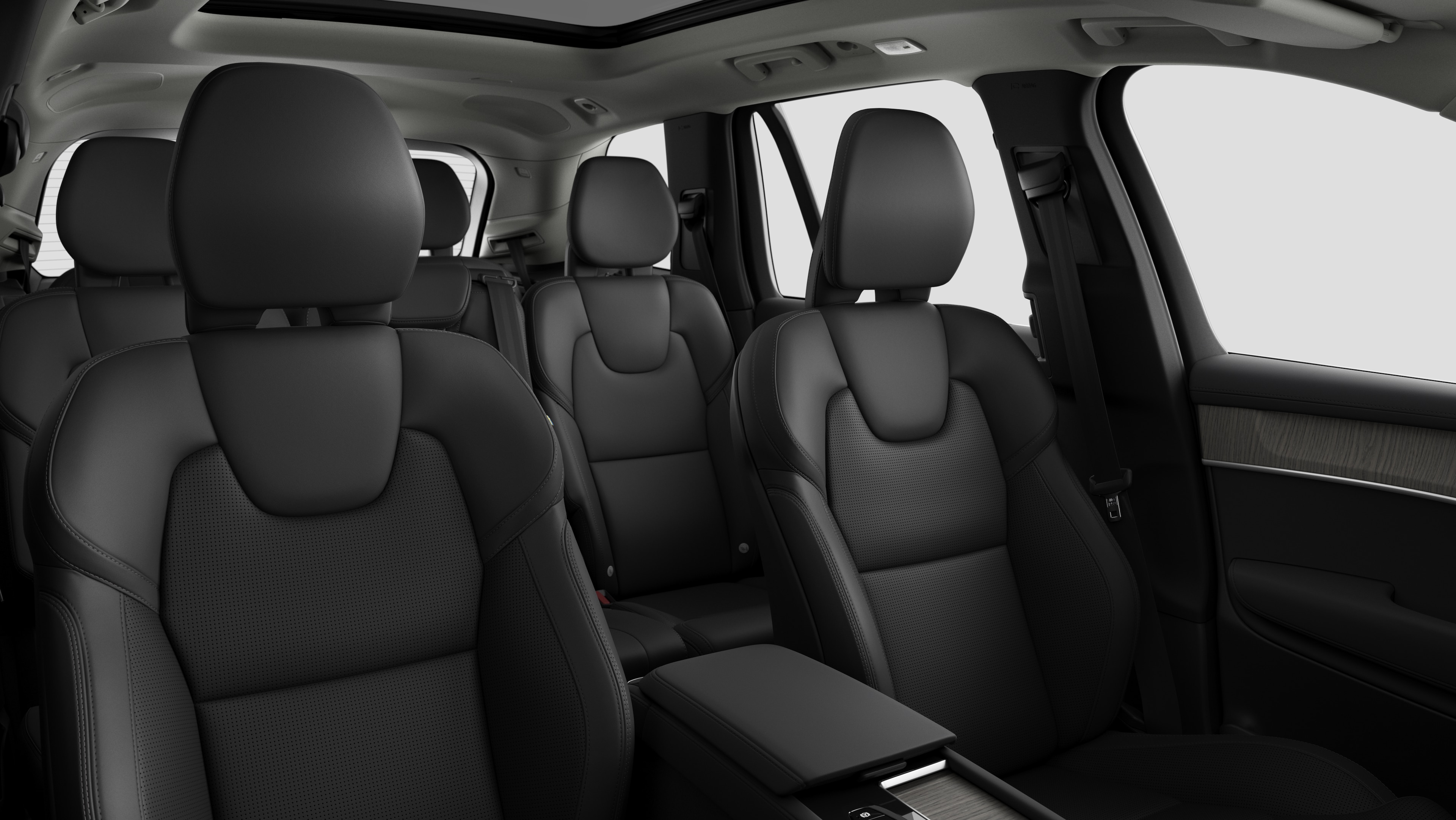 Volvo car interior showing rear passenger seats and center console in plain studio background.