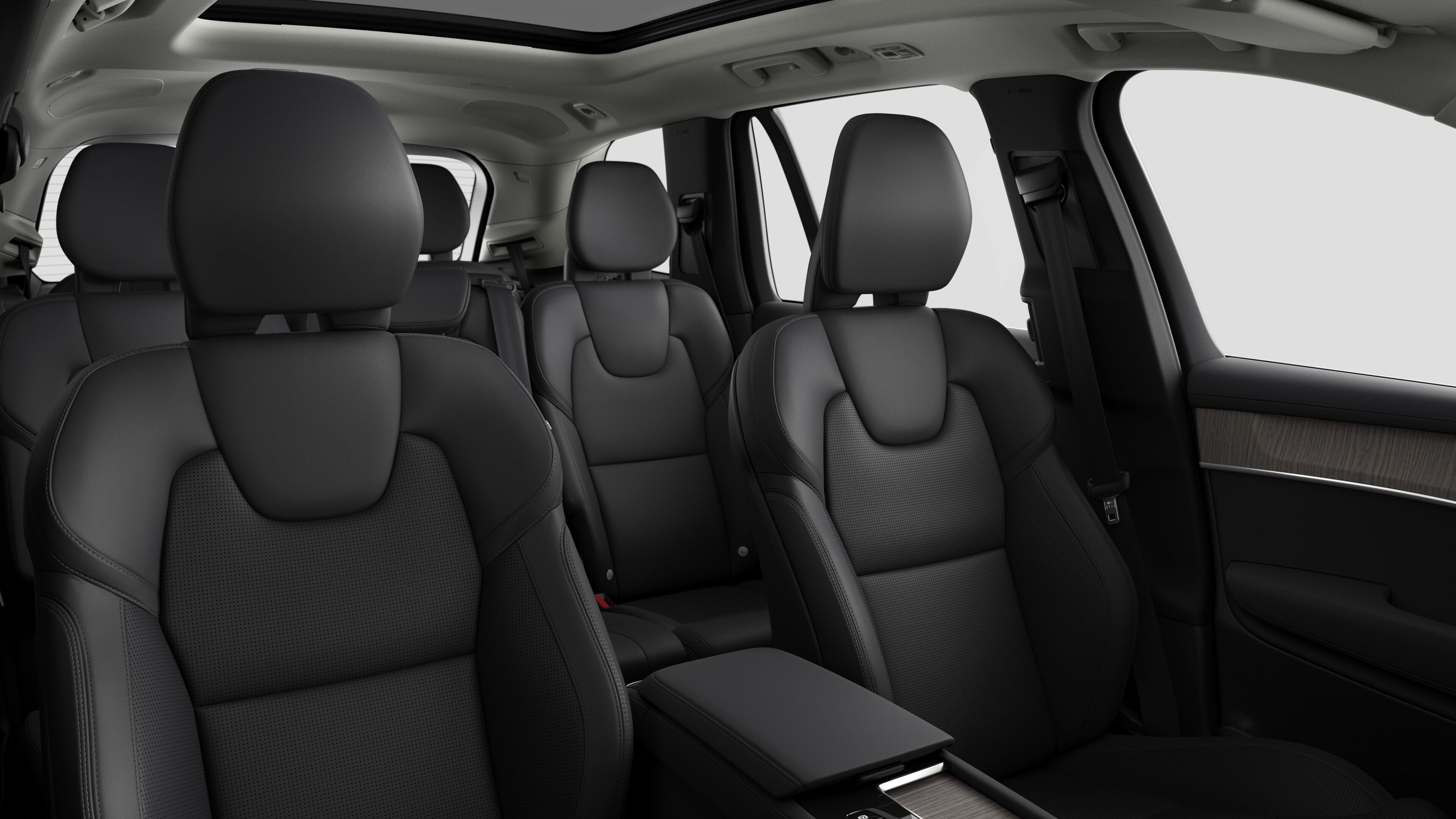 Volvo car interior showing rear passenger seats and center console in plain studio background.