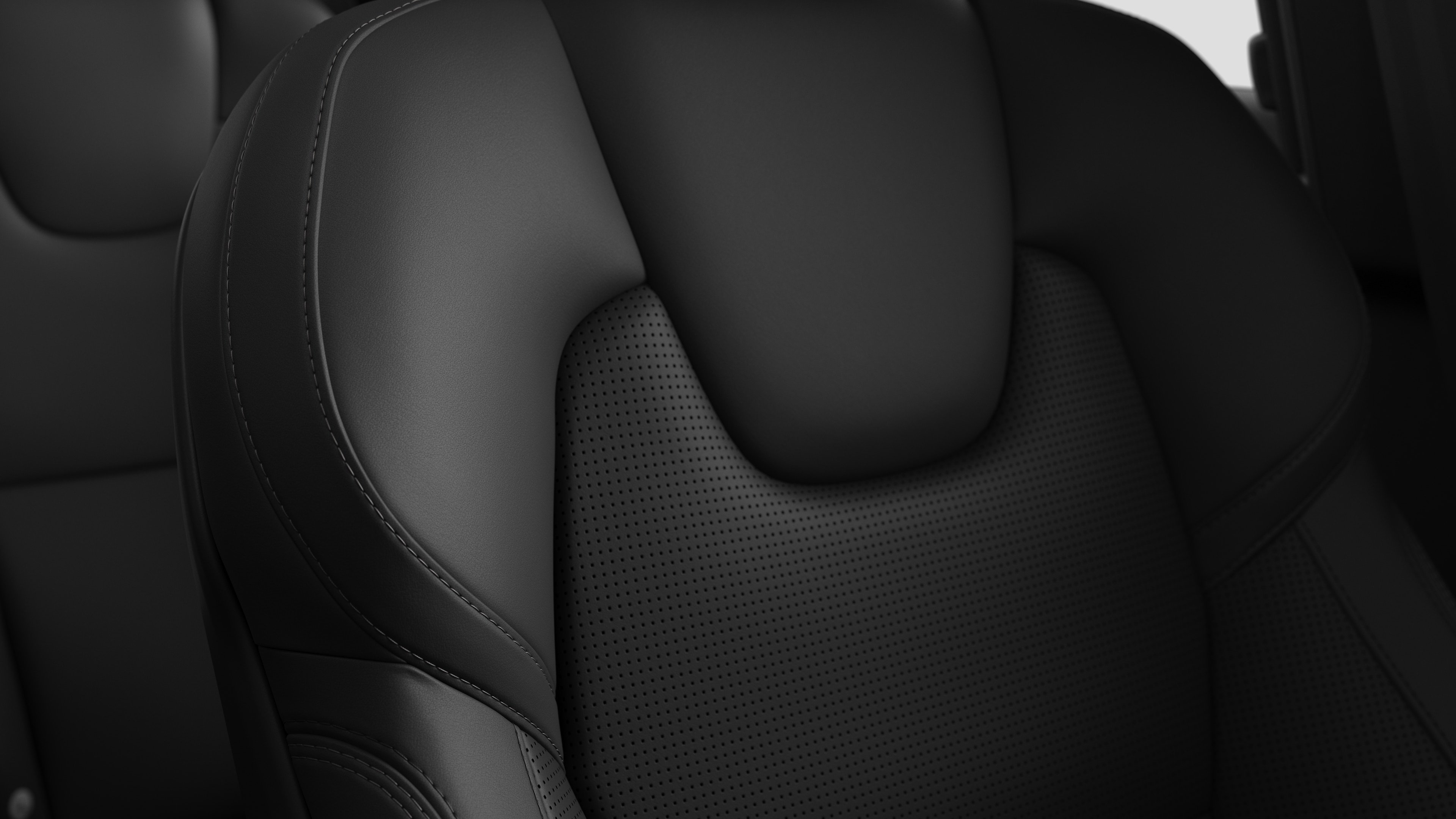 Close-up of Volvo car interior seat detail showing stitching and a small Swedish flag tag.