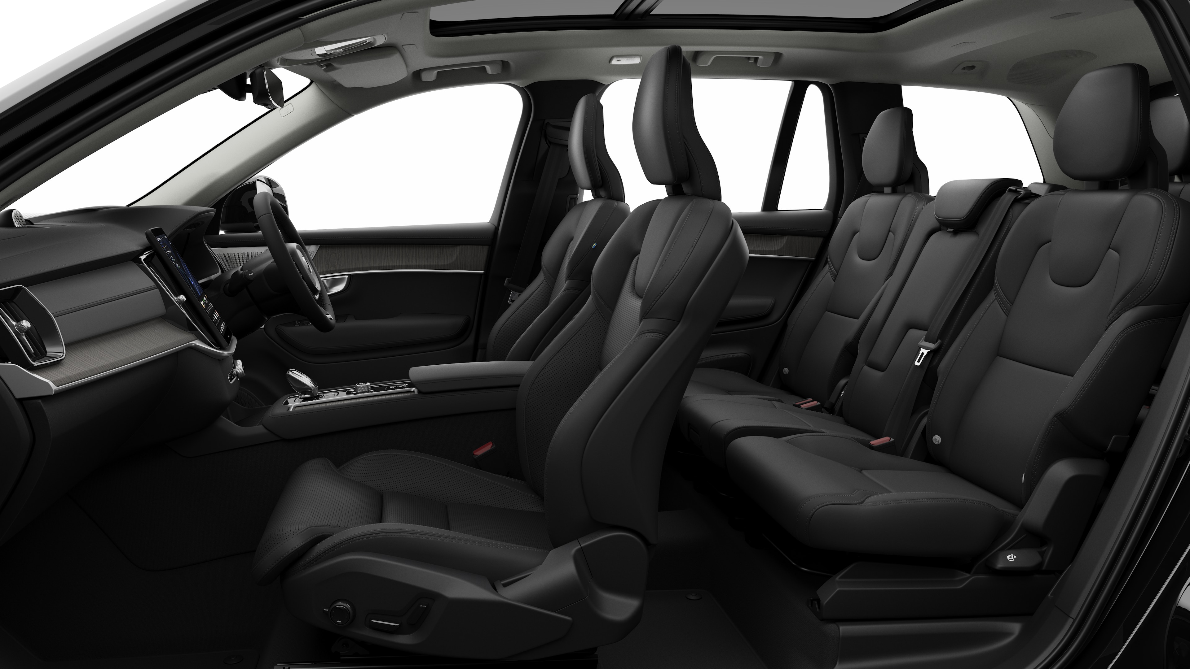 Volvo car interior side view showcasing front seats, rear passenger seats, steering wheel, dashboard, and center console, set against plain studio background.