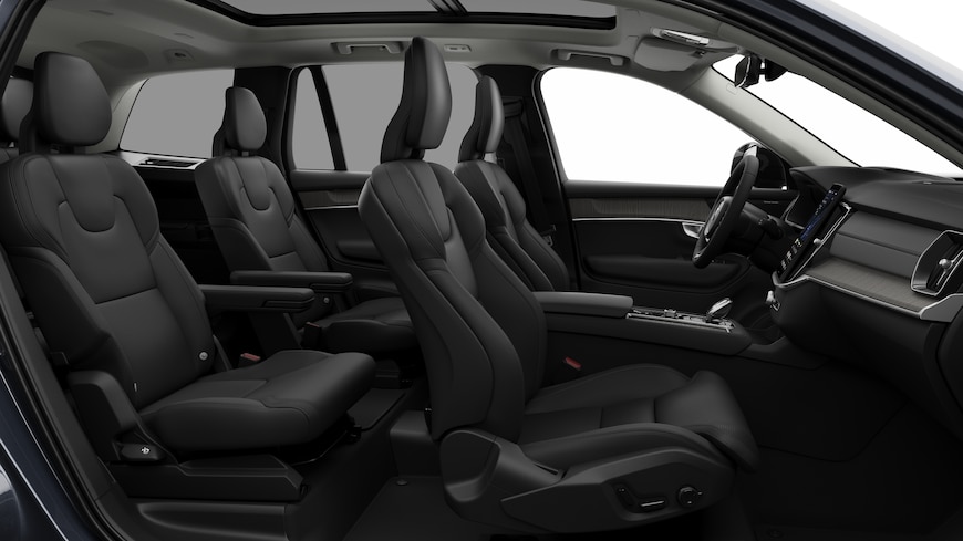 Volvo car interior side view showcasing front seats, rear passenger seats, steering wheel, dashboard, and center console, set against plain studio background.