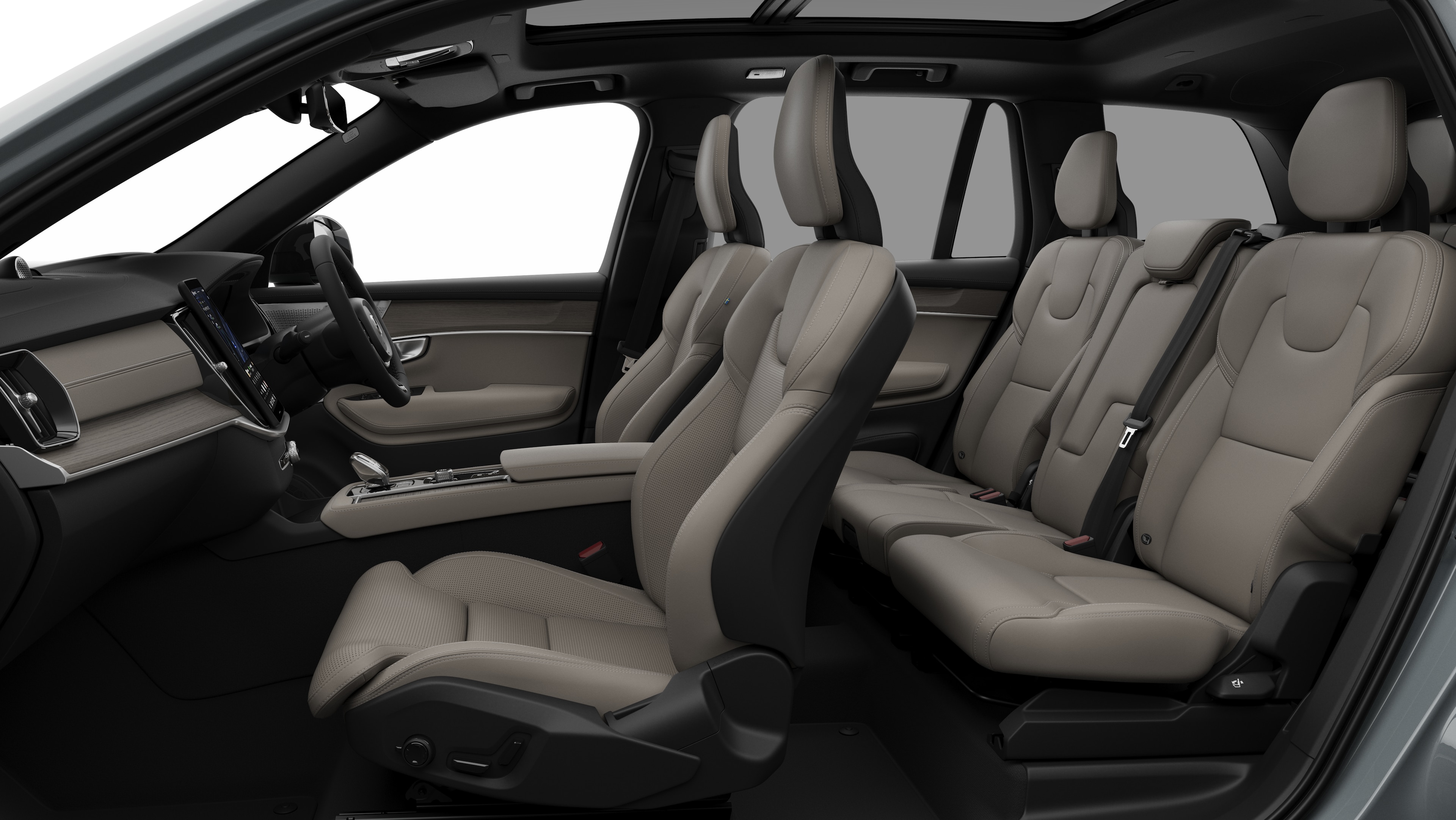 Volvo car interior side view showcasing front seats, rear passenger seats, steering wheel, dashboard, and center console, set against plain studio background.