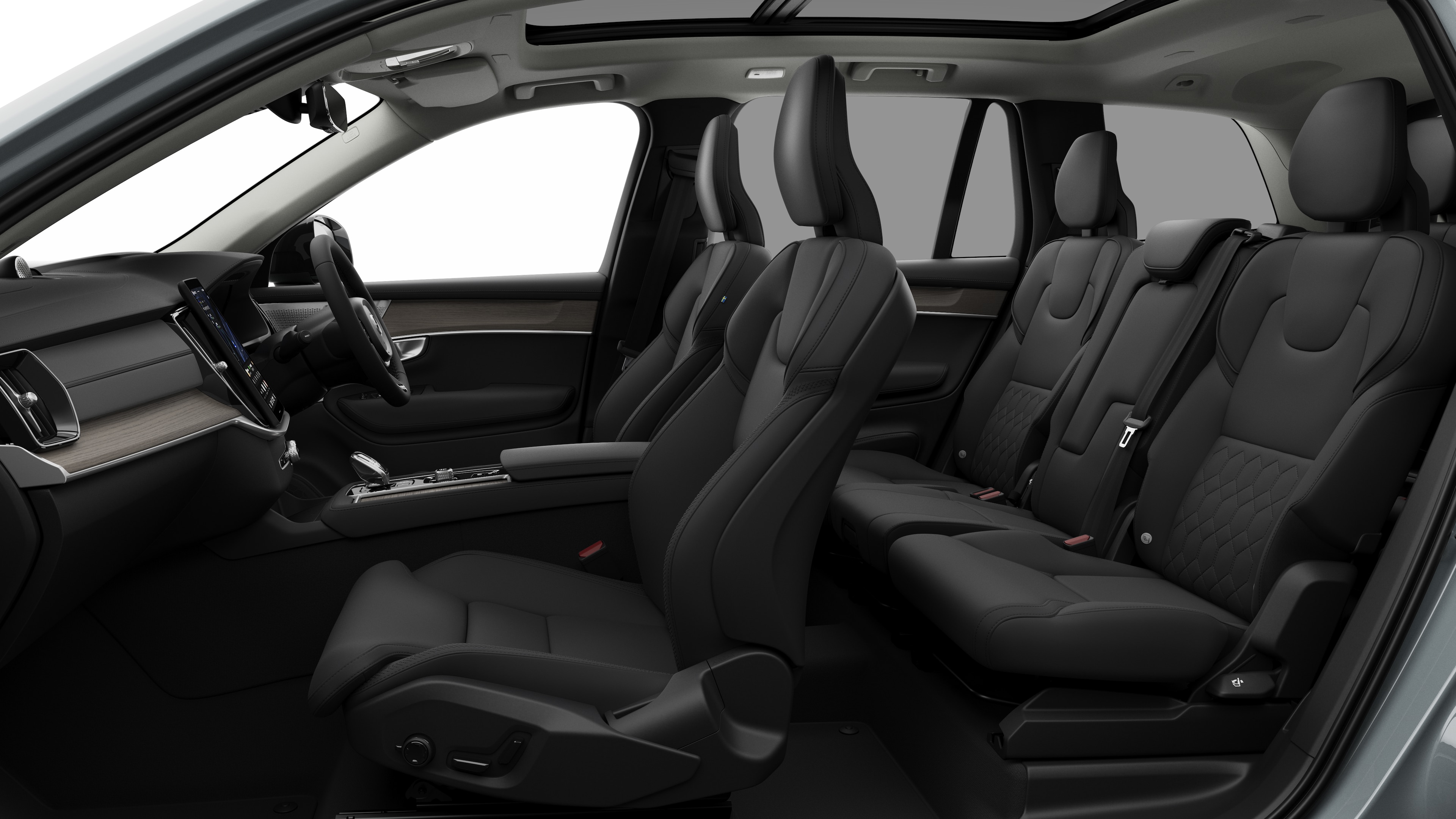 Volvo car interior side view showcasing front seats, rear passenger seats, steering wheel, dashboard, and center console, set against plain studio background.