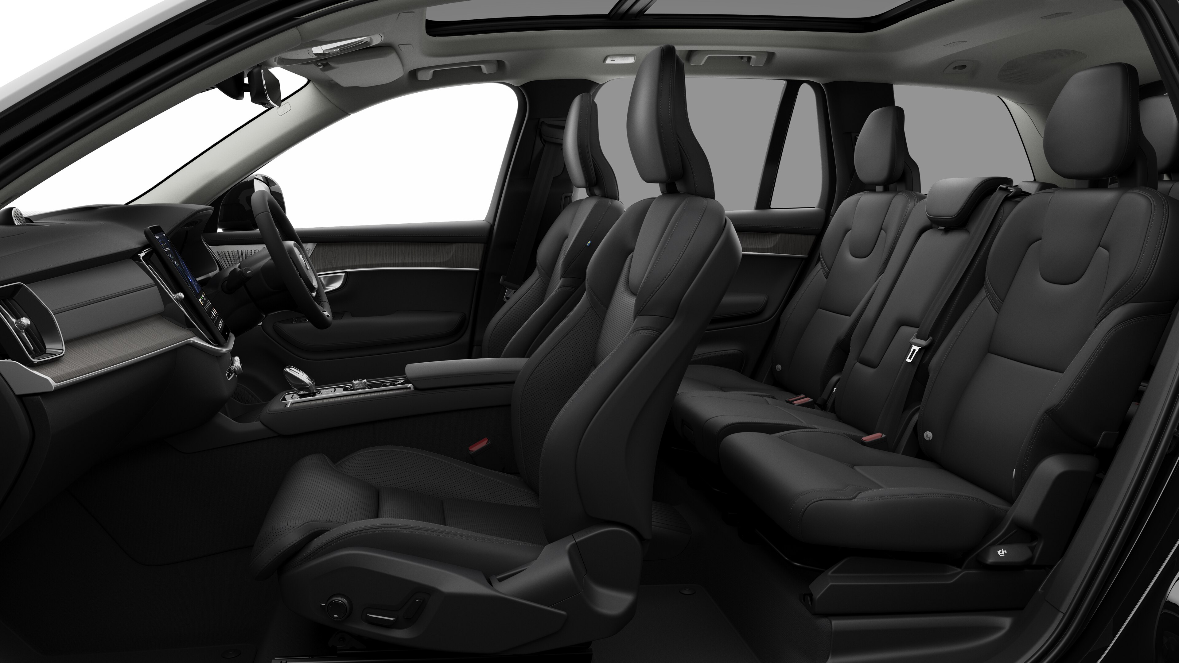 Volvo car interior side view showcasing front seats, rear passenger seats, steering wheel, dashboard, and center console, set against plain studio background.