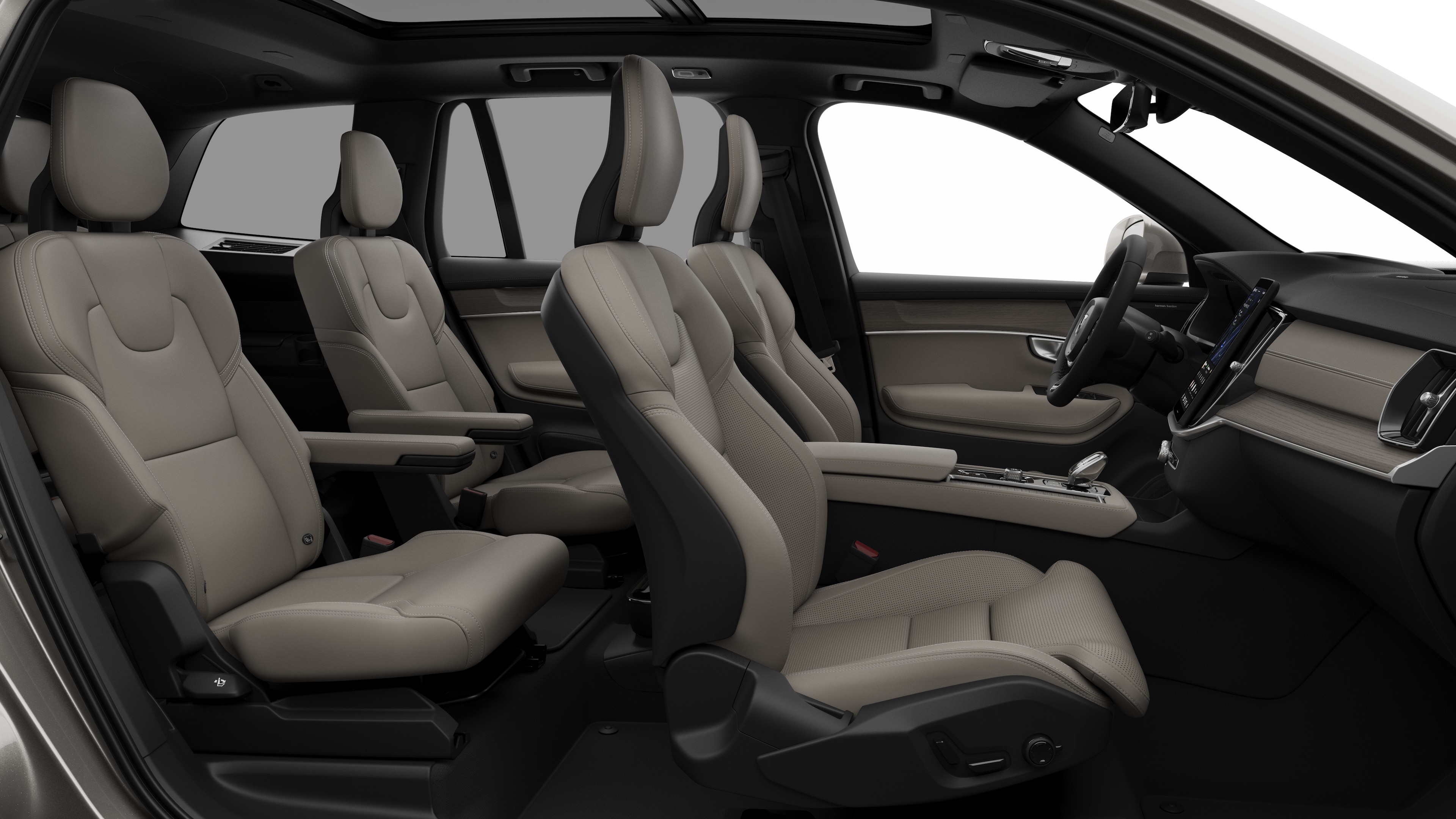 Volvo car interior side view showcasing front seats, rear passenger seats, steering wheel, dashboard, and center console, set against plain studio background.