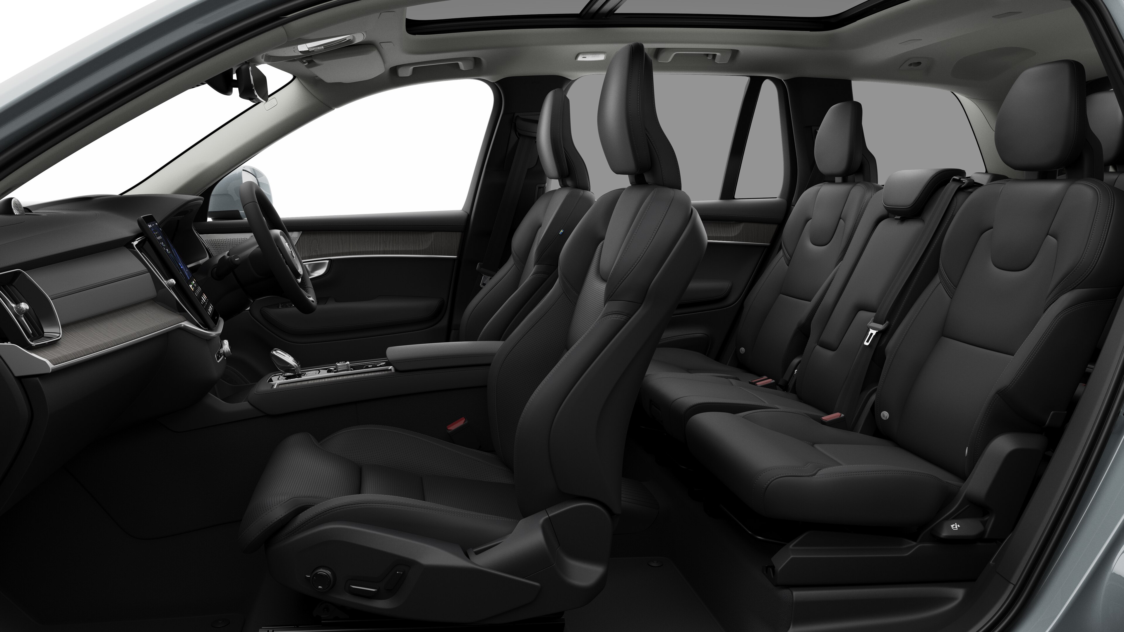 Volvo car interior side view showcasing front seats, rear passenger seats, steering wheel, dashboard, and center console, set against plain studio background.