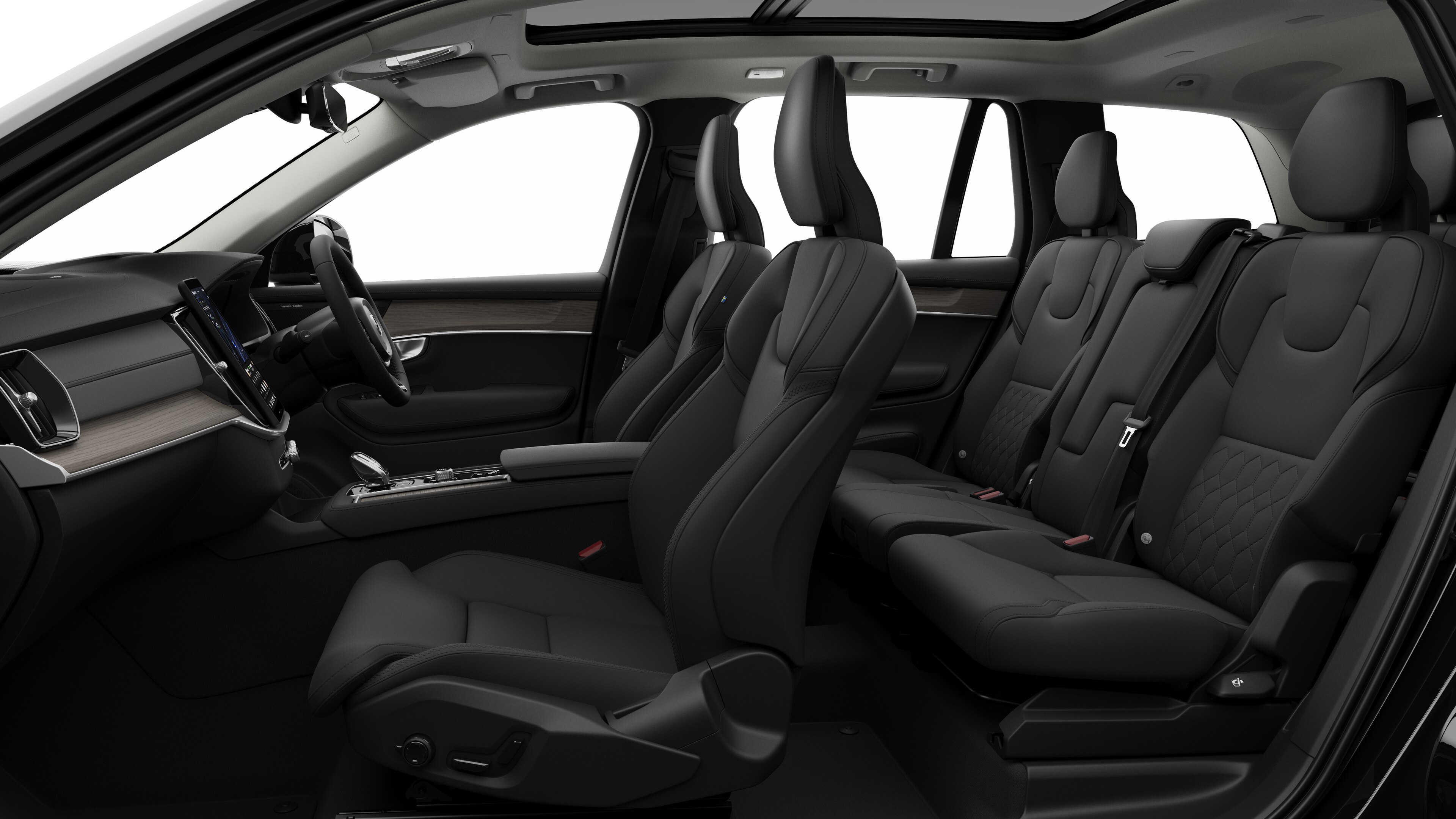 Volvo car interior side view showcasing front seats, rear passenger seats, steering wheel, dashboard, and center console, set against plain studio background.
