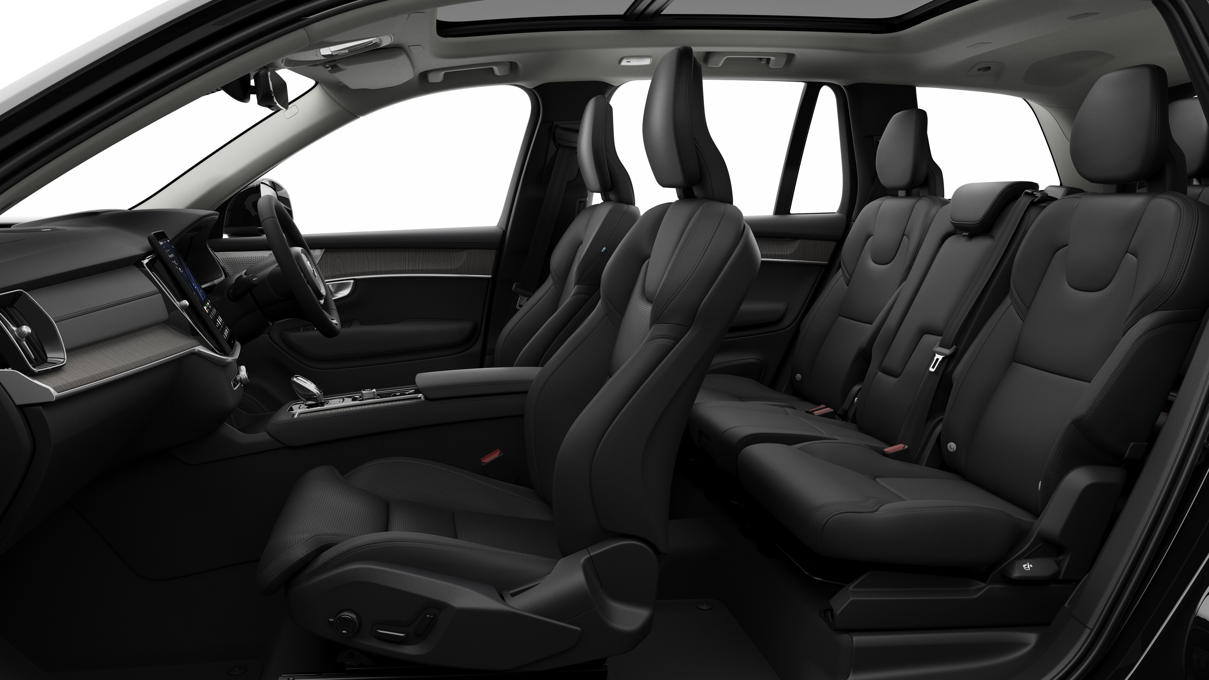 Volvo car interior side view showcasing front seats, rear passenger seats, steering wheel, dashboard, and center console, set against plain studio background.