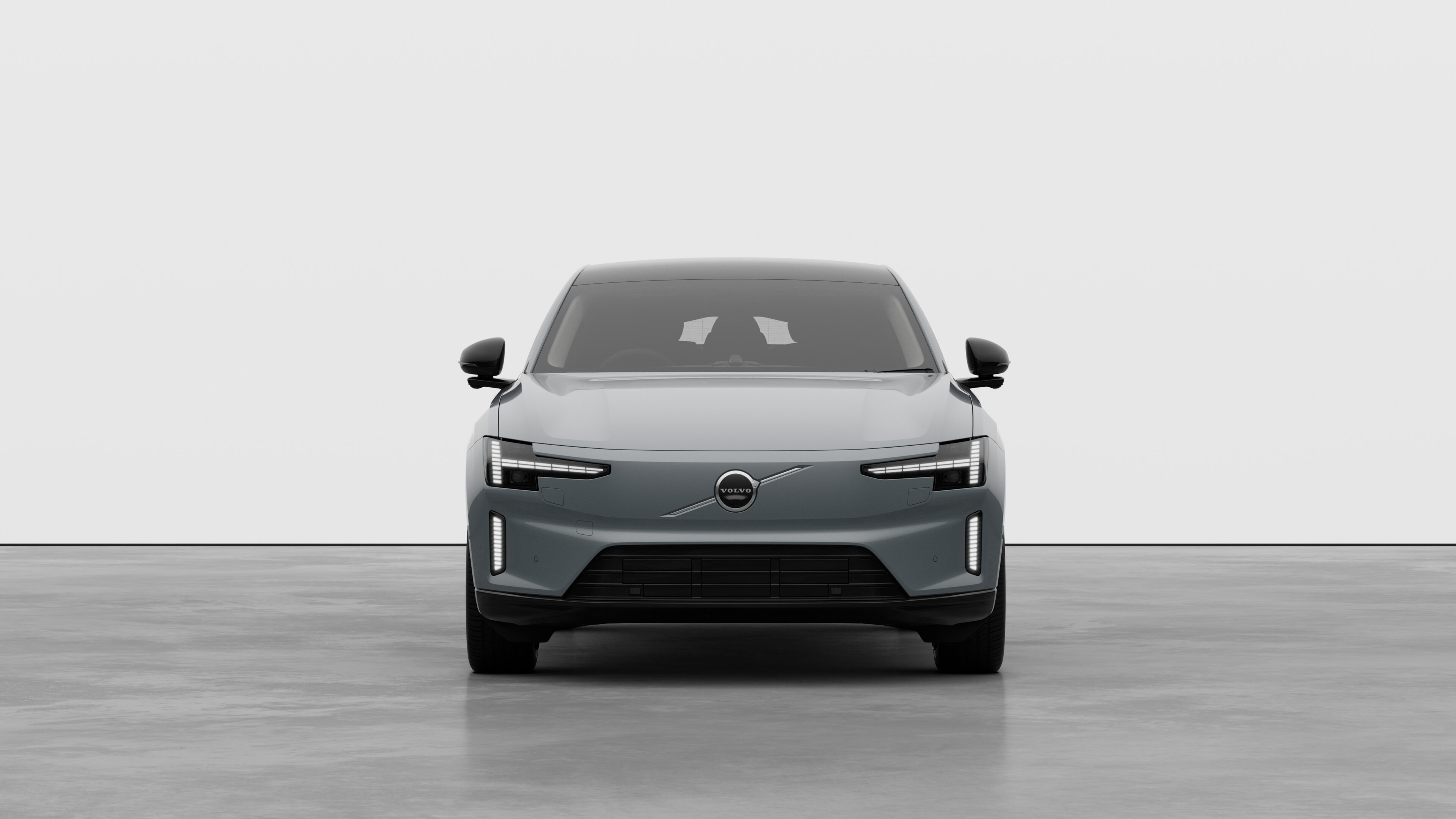 Front view of a Volvo car in a plain studio background.