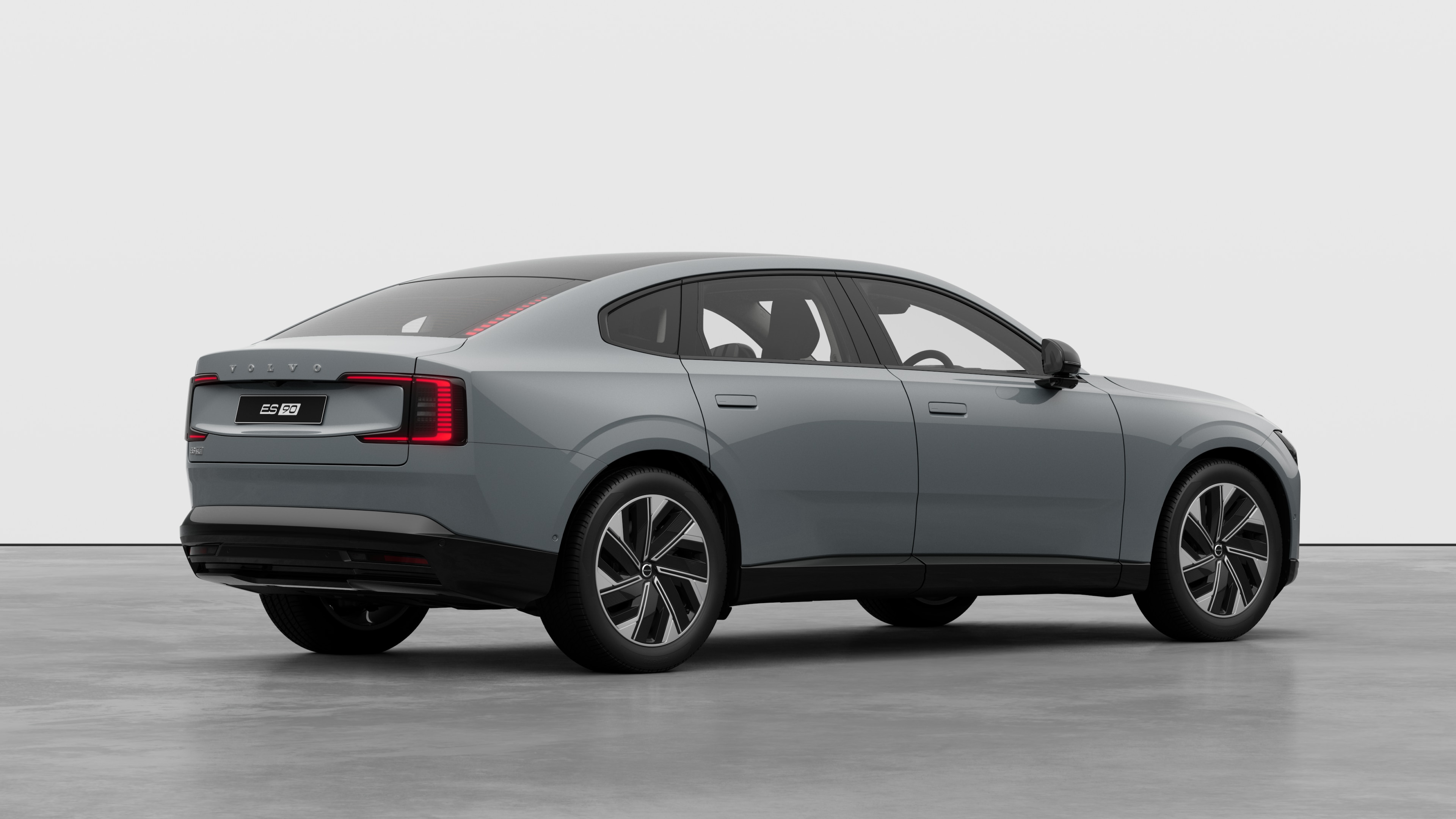 Volvo car rear three-quarter view on plain studio background.