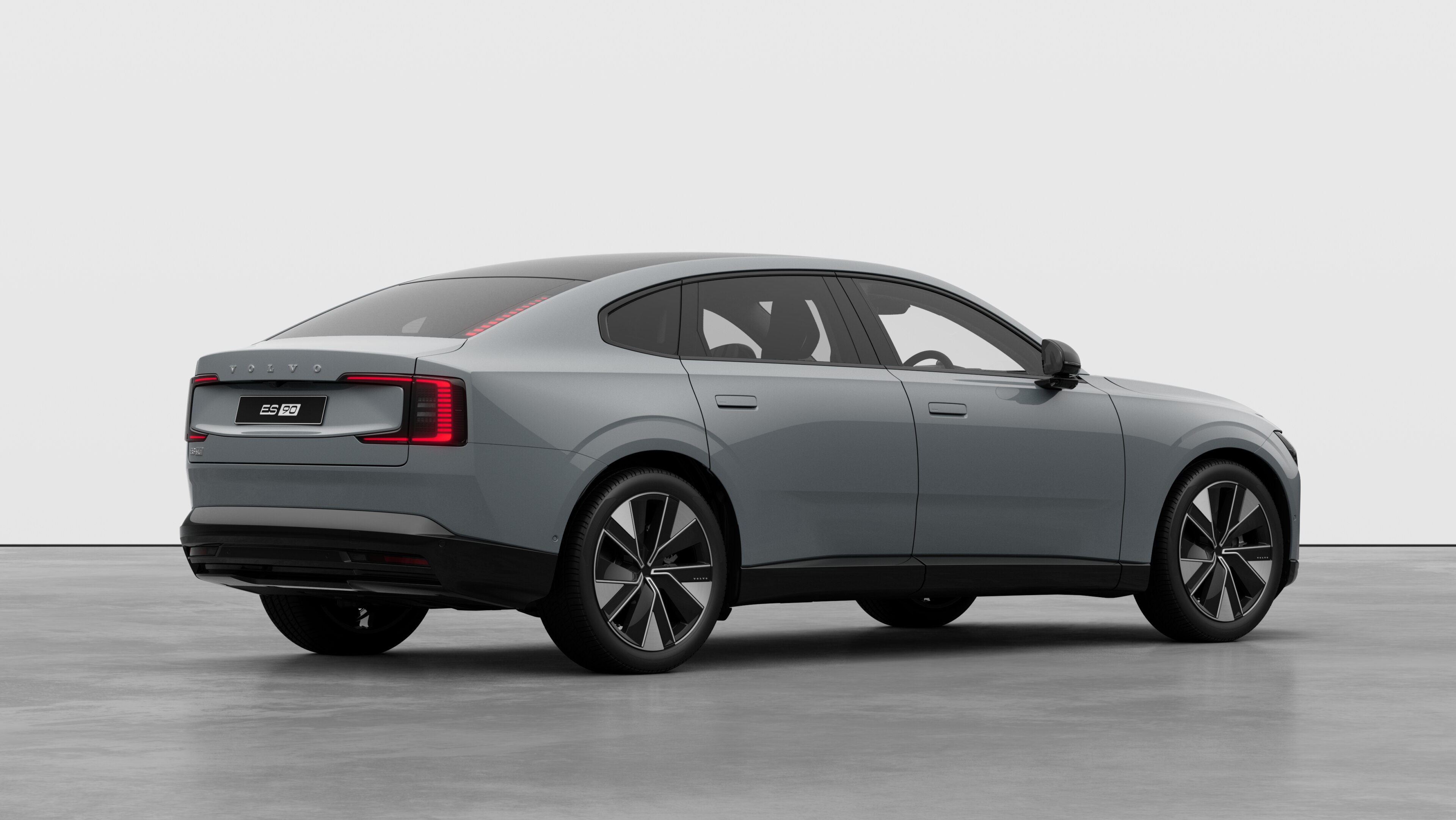 Volvo car rear three-quarter view on plain studio background.