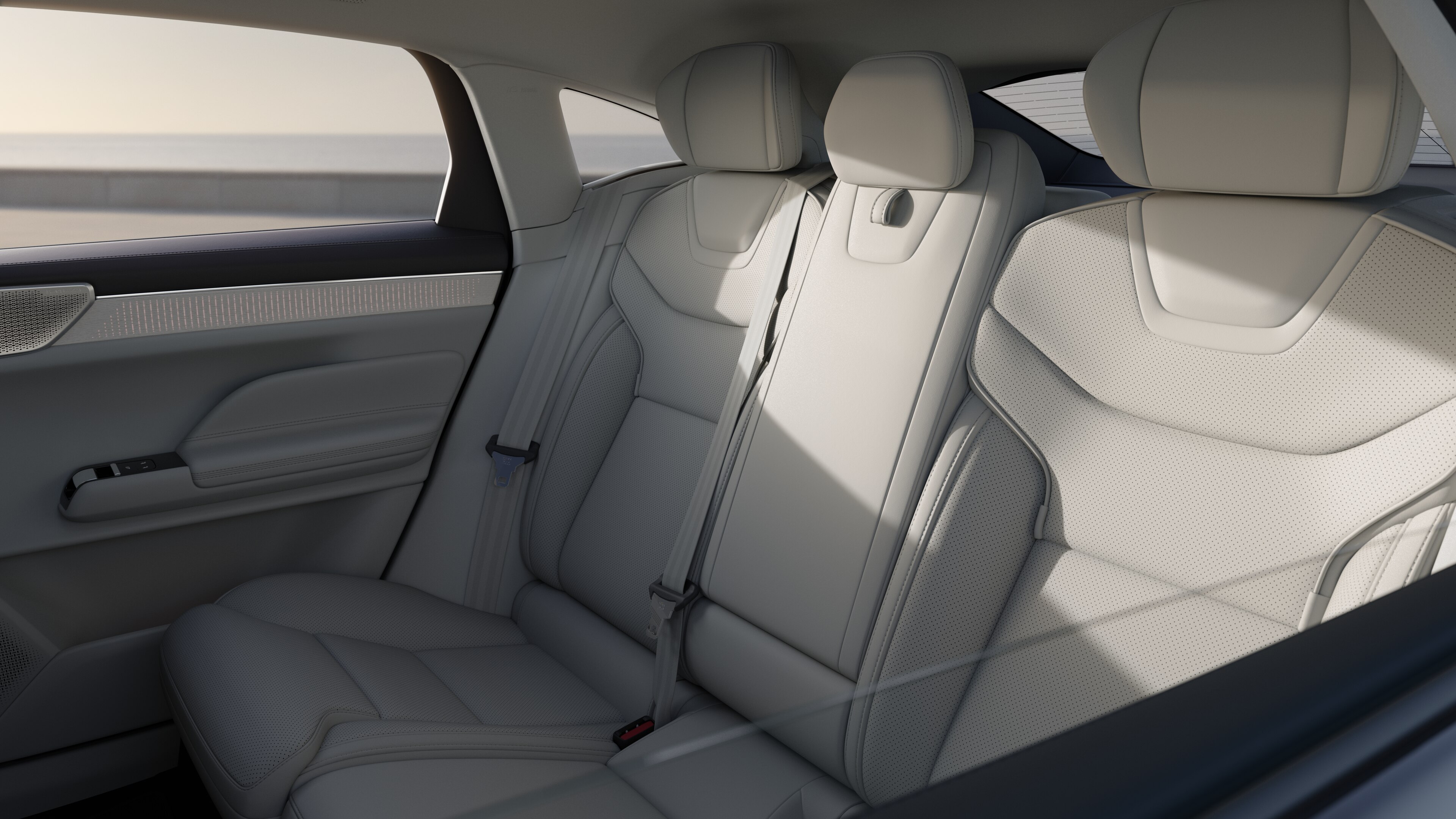 Volvo car interior showing front and rear passenger seats, steering wheel, dashboard, and center console against a plain studio background.