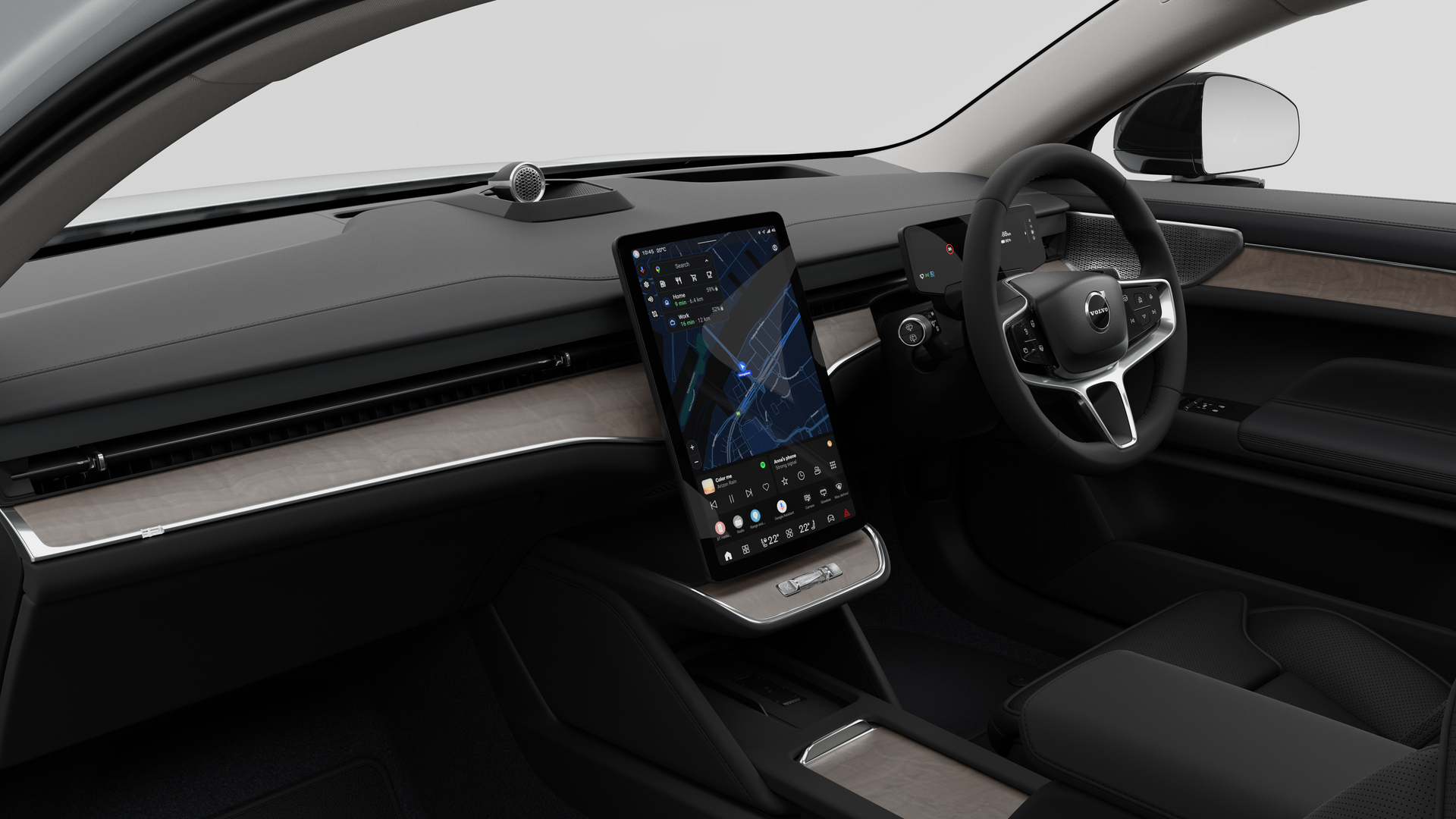 มุมมองภายในของรถยนต์ Volvo ที่แสดงแผงหน้าปัด พวงมาลัย คอนโซลกลาง และหน้าจอแสดงผลดิจิทัลในพื้นหลังสตูดิโอธรรมดา