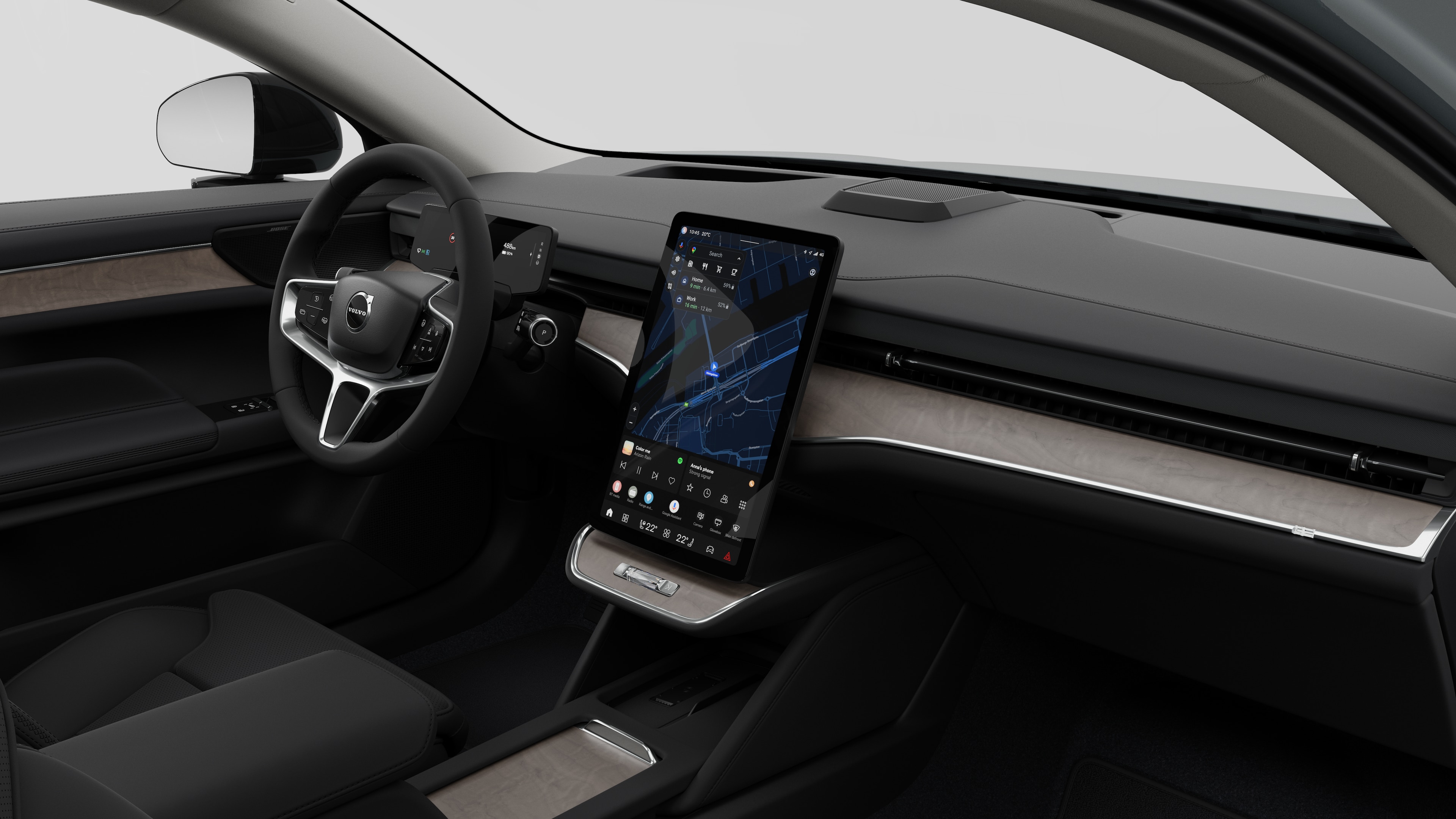 Interiörvy av en Volvobil som visar instrumentbrädan, ratten, mittkonsolen och den digitala skärmen i en vanlig studiobakgrund.