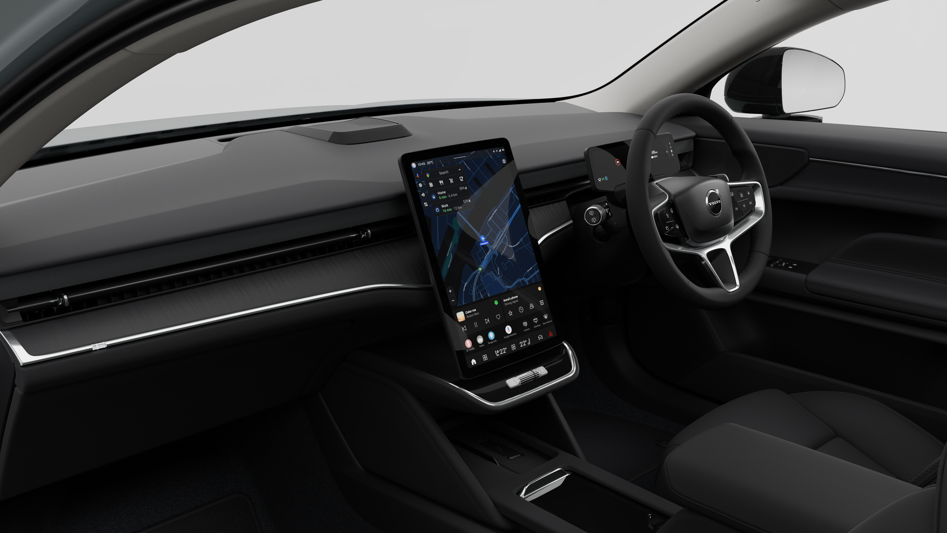 Interior view of a Volvo car showing the dashboard, steering wheel, center console, and digital display screen in a plain studio background.