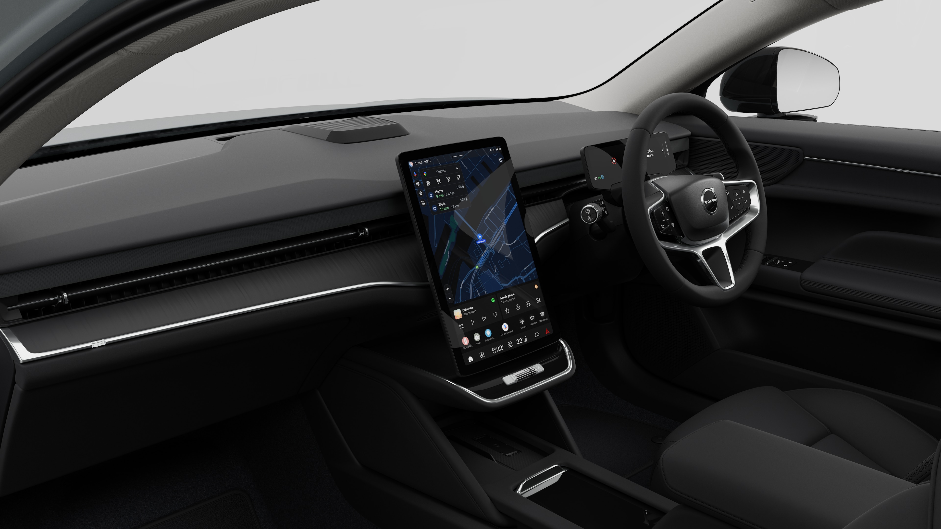 Interior view of a Volvo car showing the dashboard, steering wheel, center console, and digital display screen in a plain studio background.