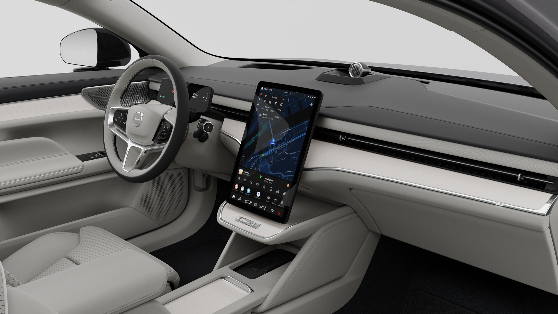 Vue intérieure d’une Volvo montrant le tableau de bord, le volant, la console centrale et l’écran d’affichage numérique sur un fond de studio uni.