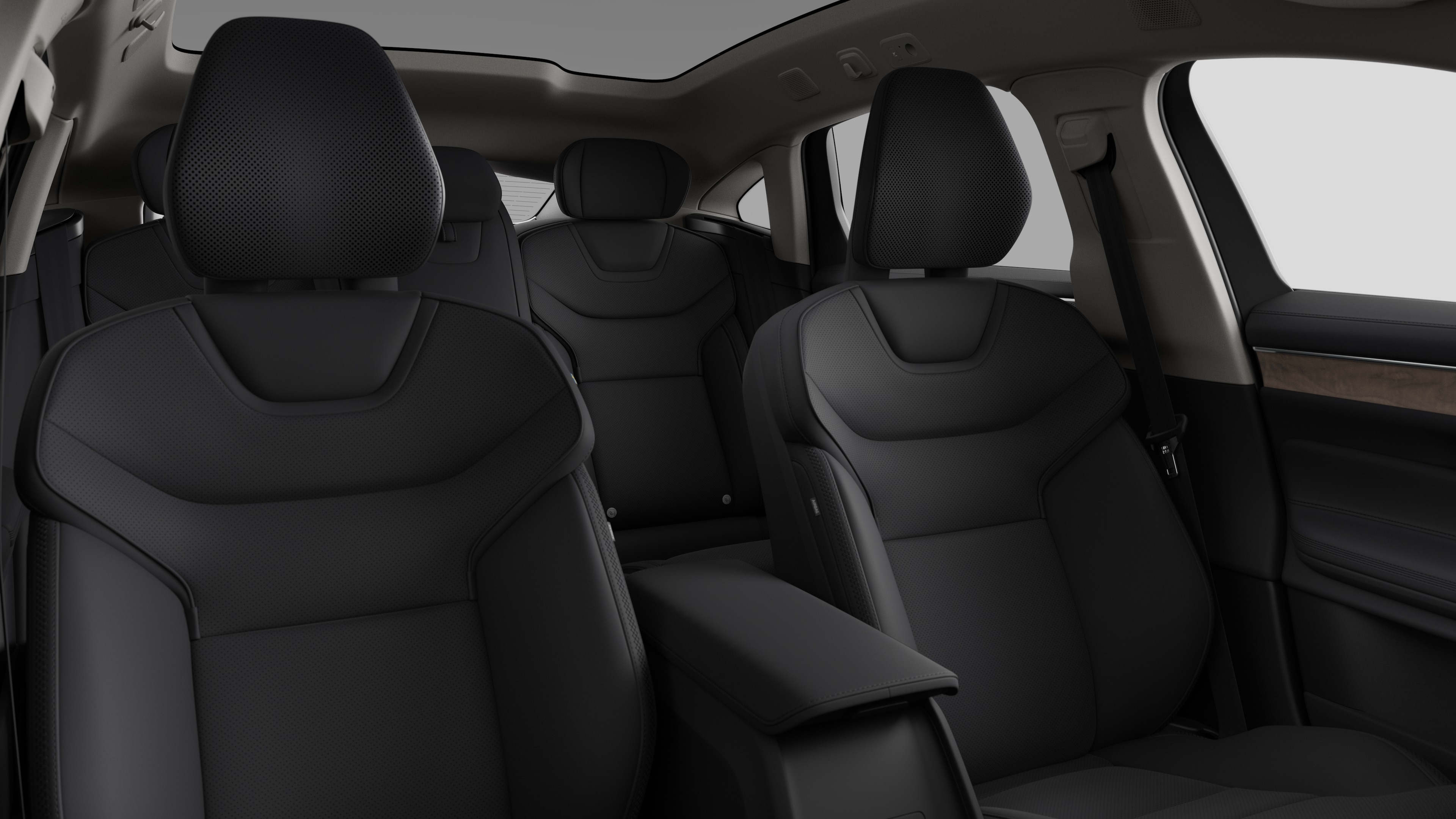 Volvo car interior showing rear passenger seats and center console in plain studio background.