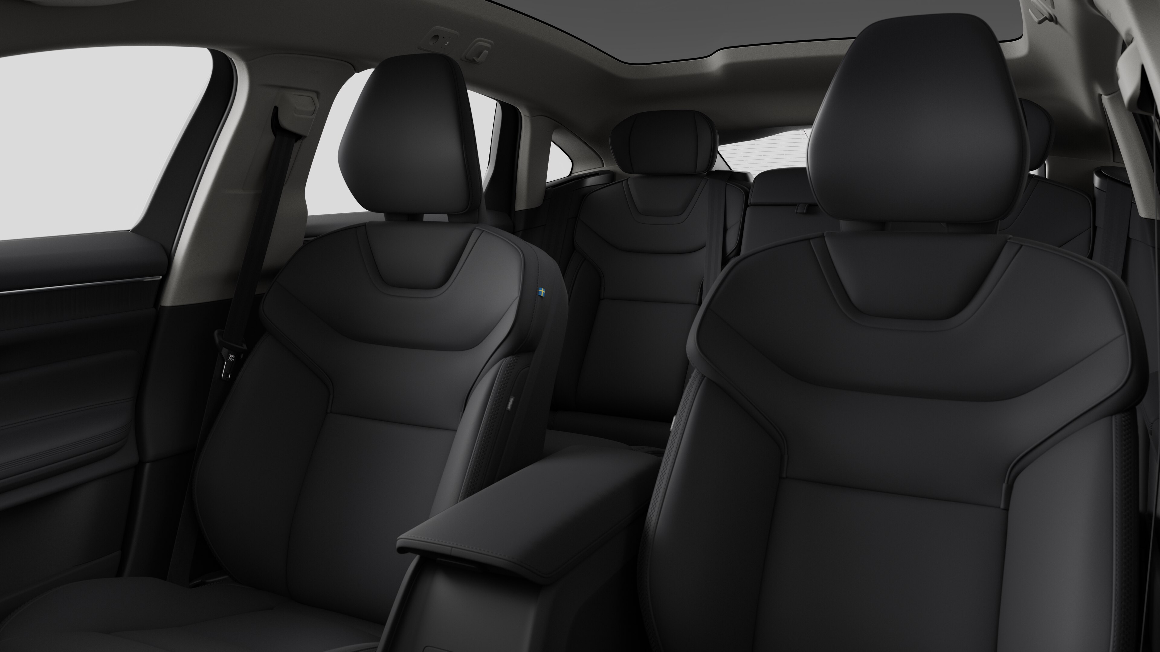 Интериор на автомобил Volvo, показващ задните седалки на пътниците и централната конзола в обикновен студиен фон.