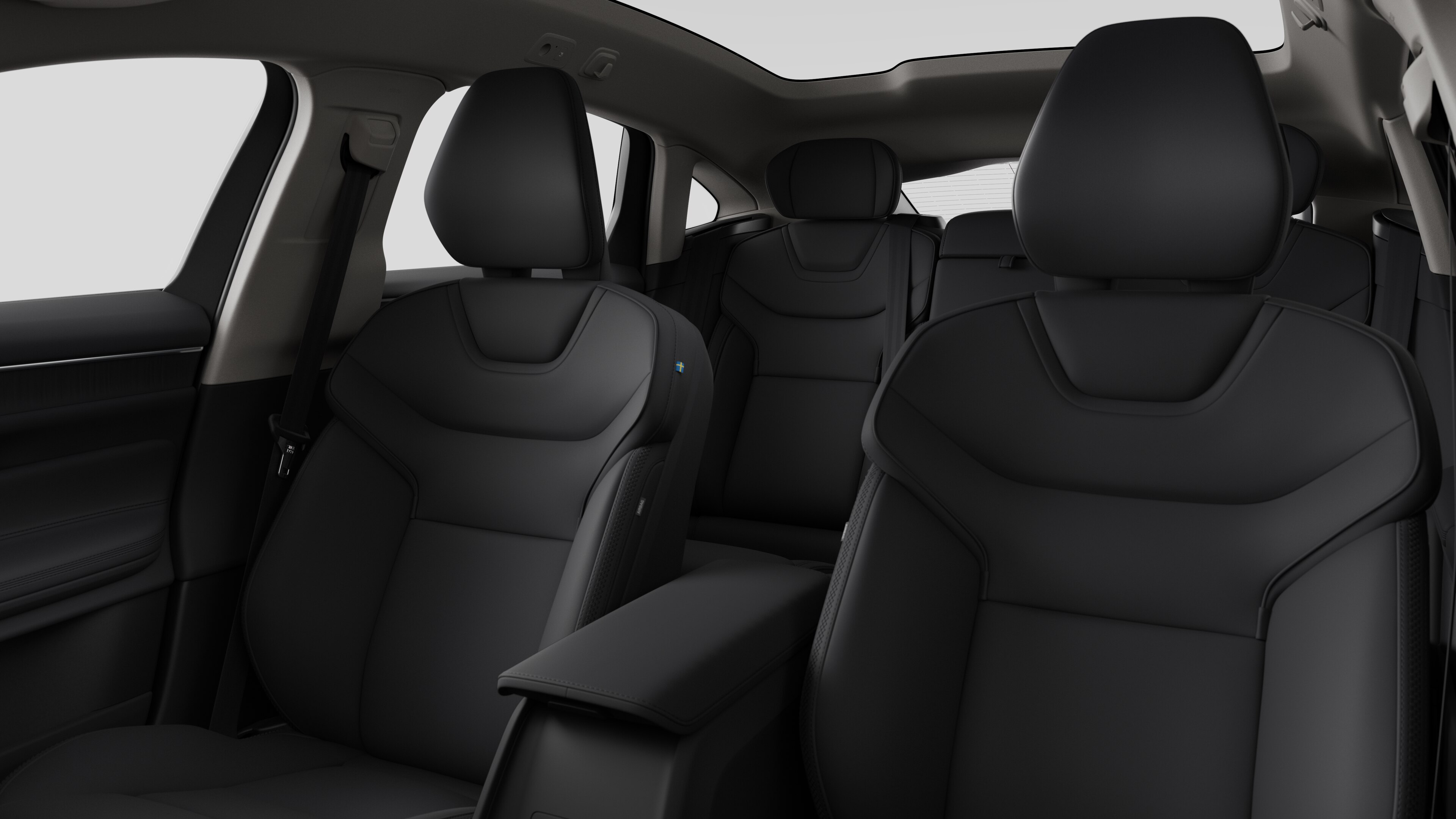 Intérieur d’une Volvo montrant les sièges passagers arrière et la console centrale dans un studio uni.