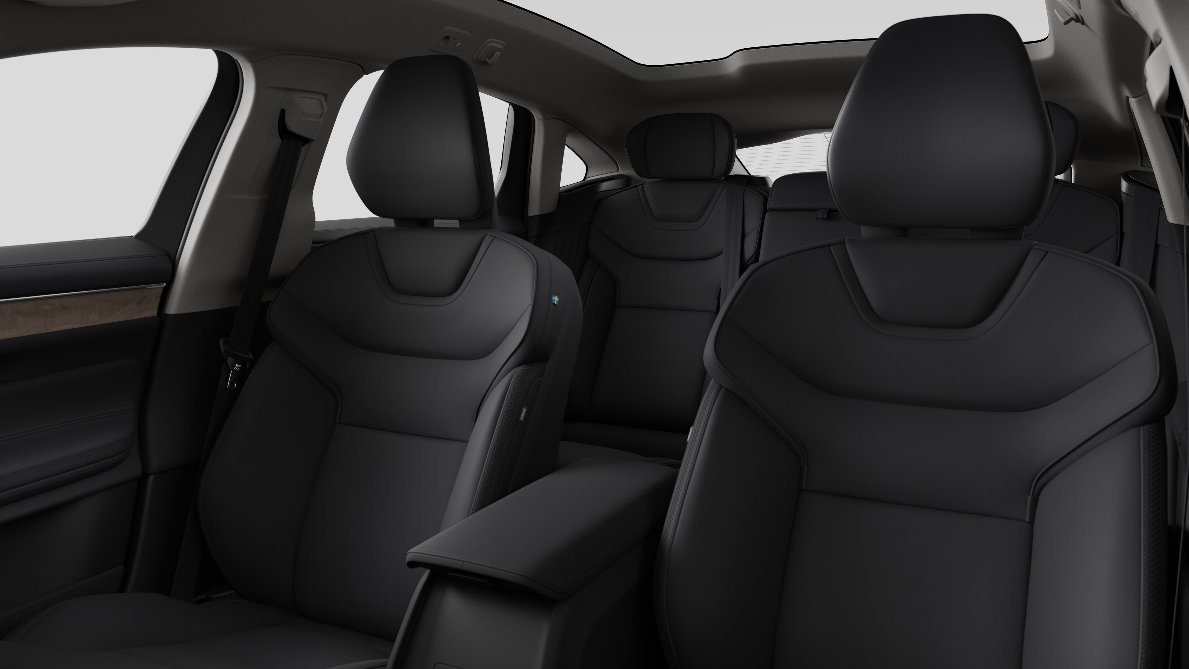 Volvo car interior showing rear passenger seats and center console in plain studio background.
