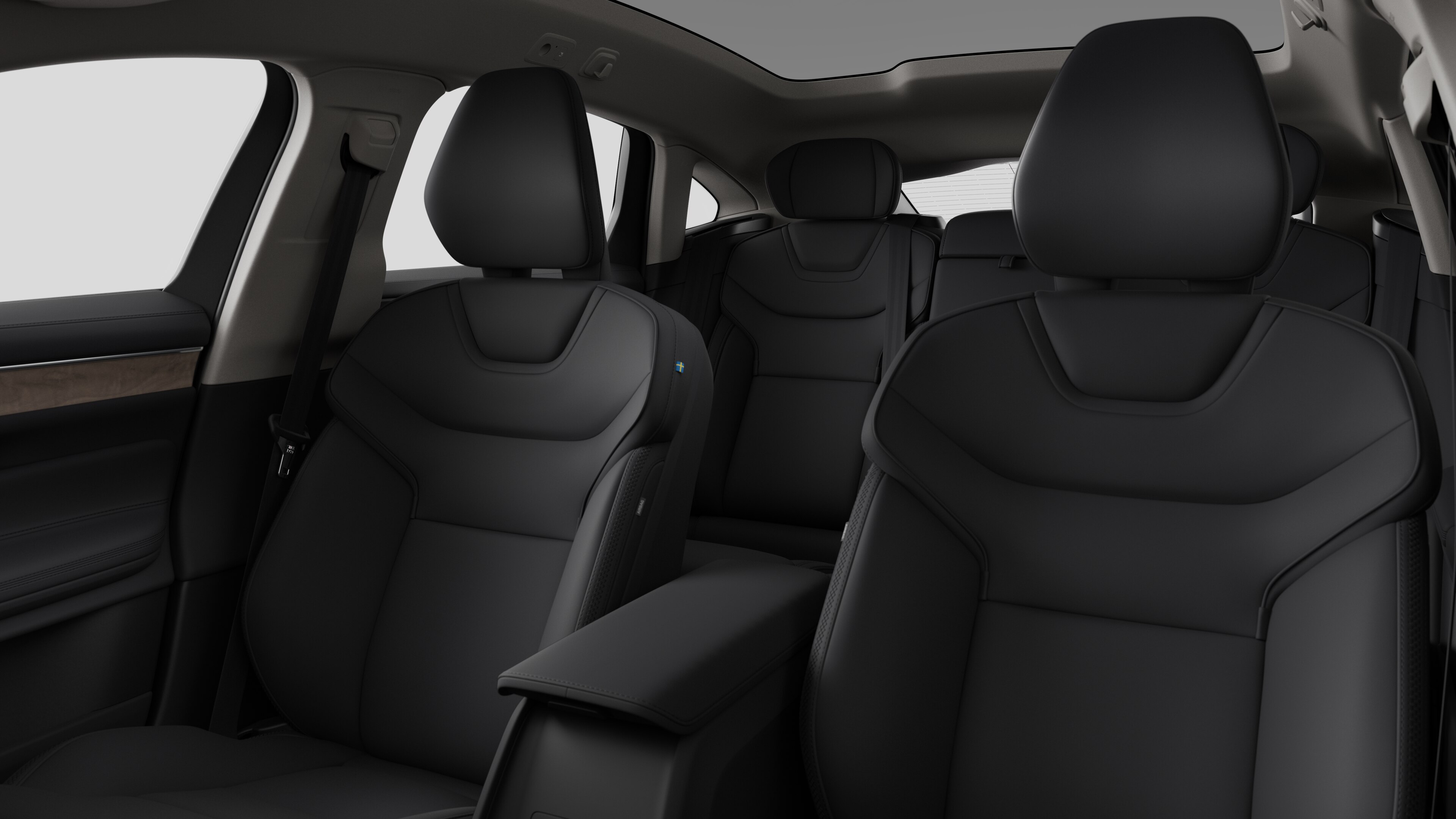 Volvo -auton sisätilat, takamatkustajan istuimet ja keskikonsoli selkeällä studiotaustalla.