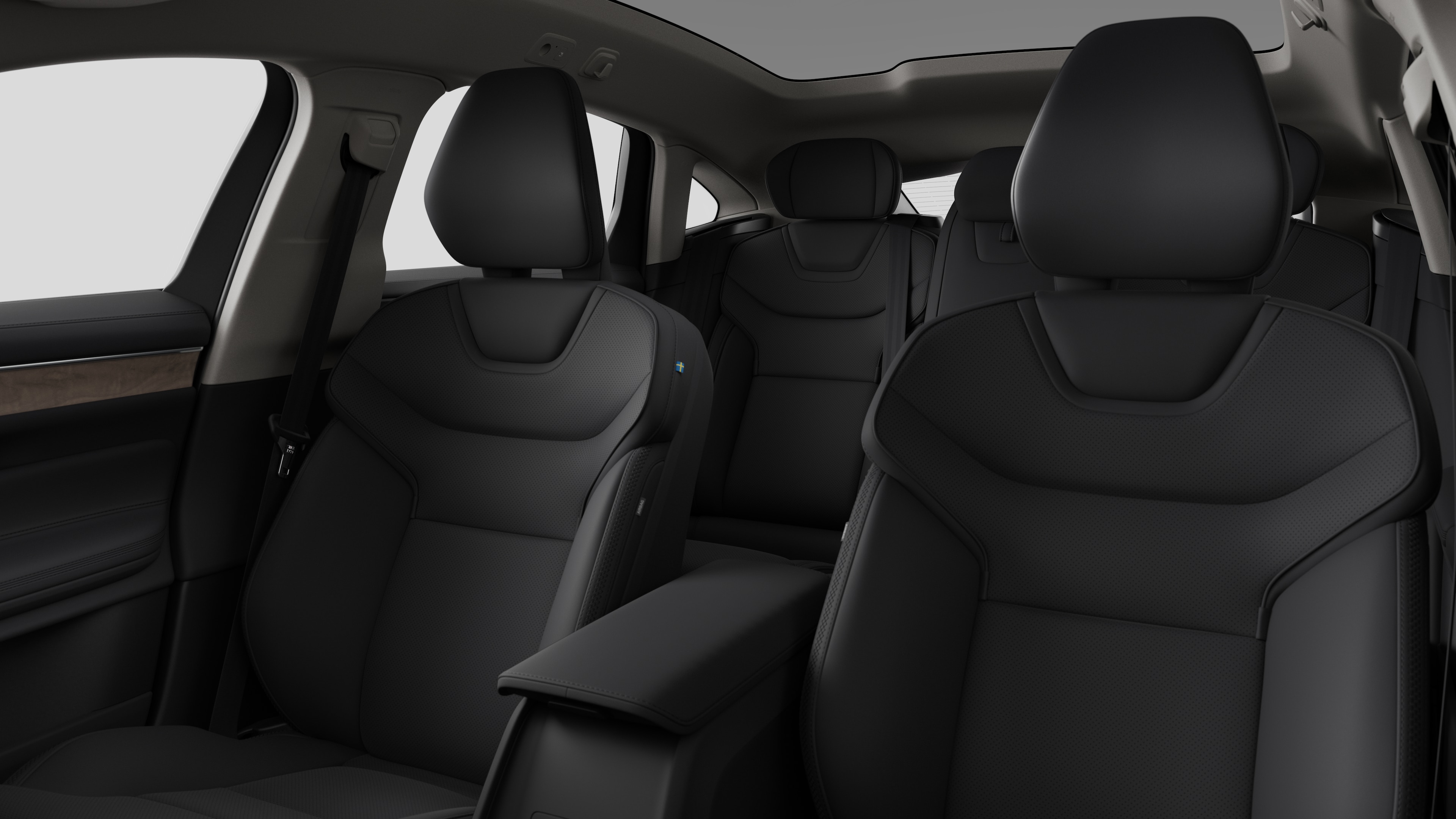 Volvo car interior showing rear passenger seats and center console in plain studio background.