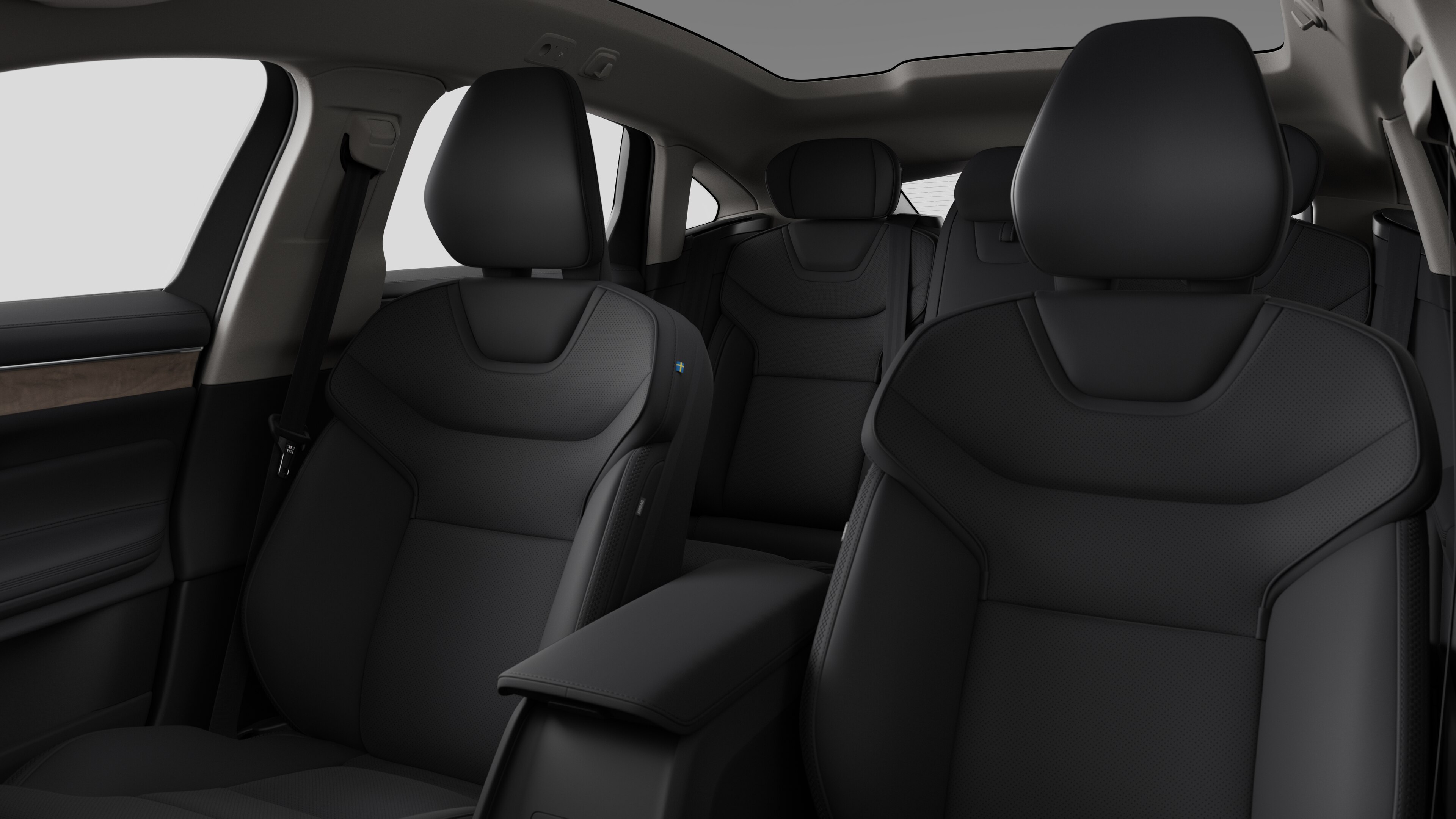 Volvo car interior showing rear passenger seats and center console in plain studio background.