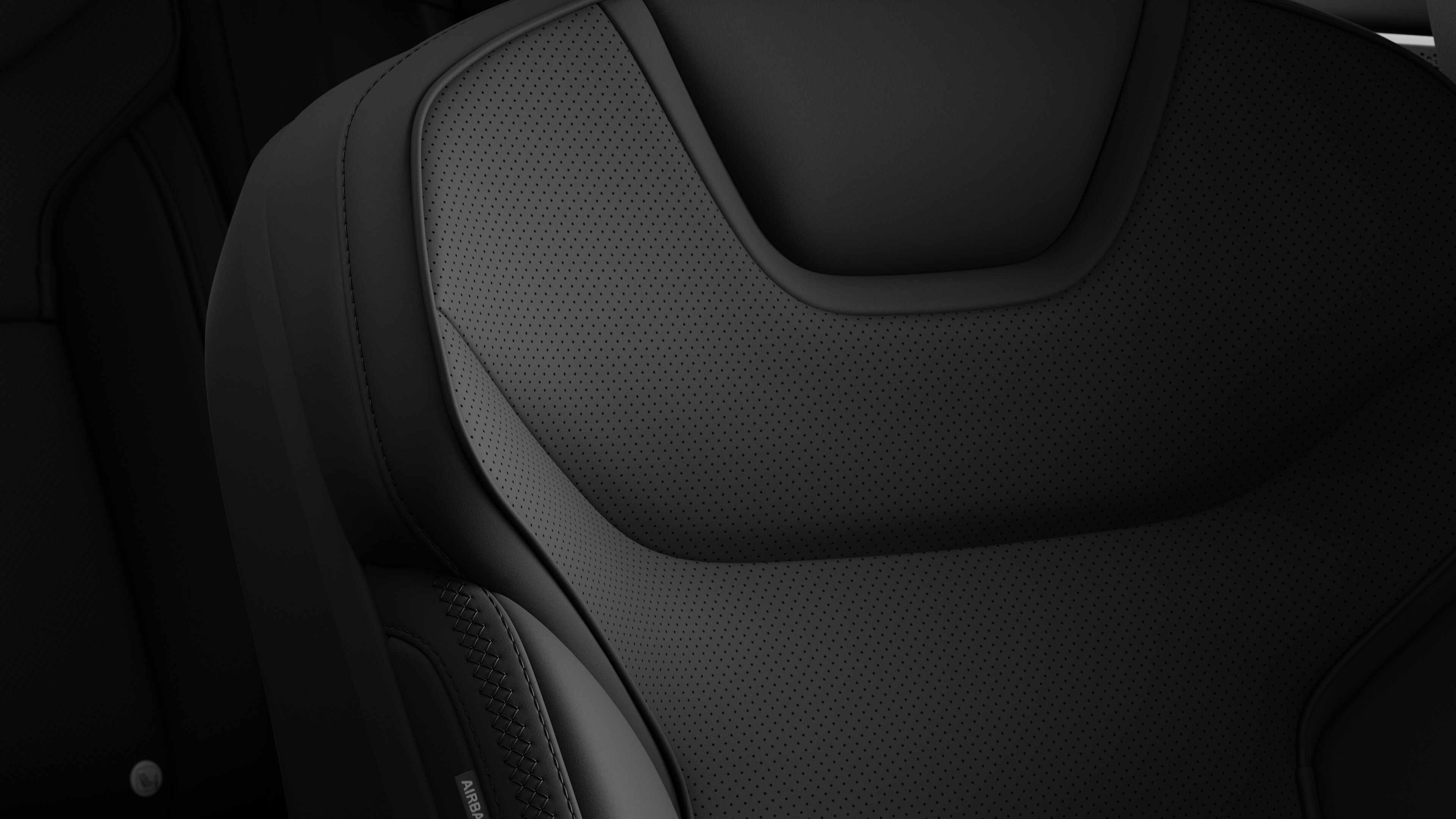 Close-up of Volvo car interior seat detail showing stitching and a small Swedish flag tag.