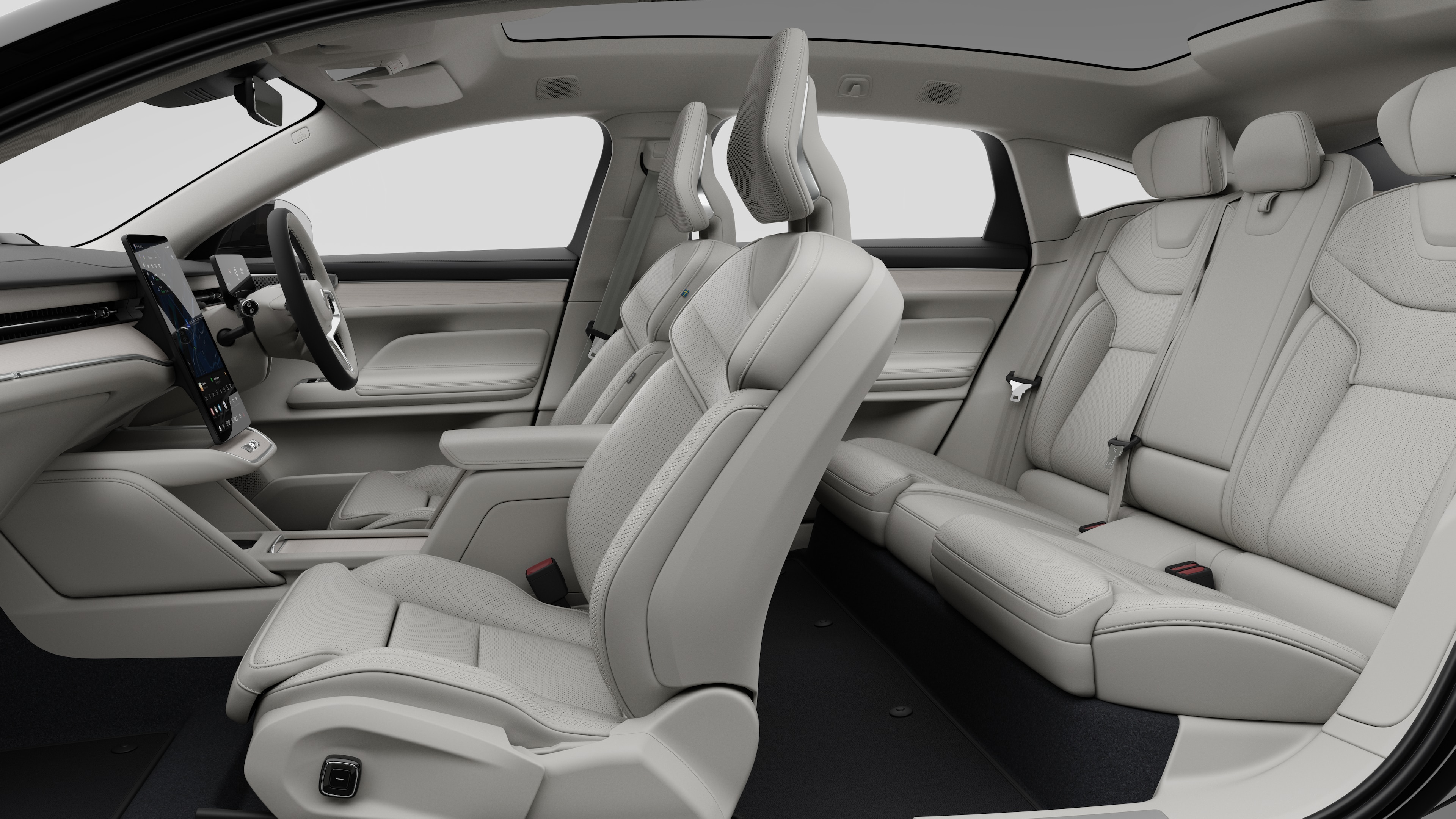Volvo car interior side view showcasing front seats, rear passenger seats, steering wheel, dashboard, and center console, set against plain studio background.