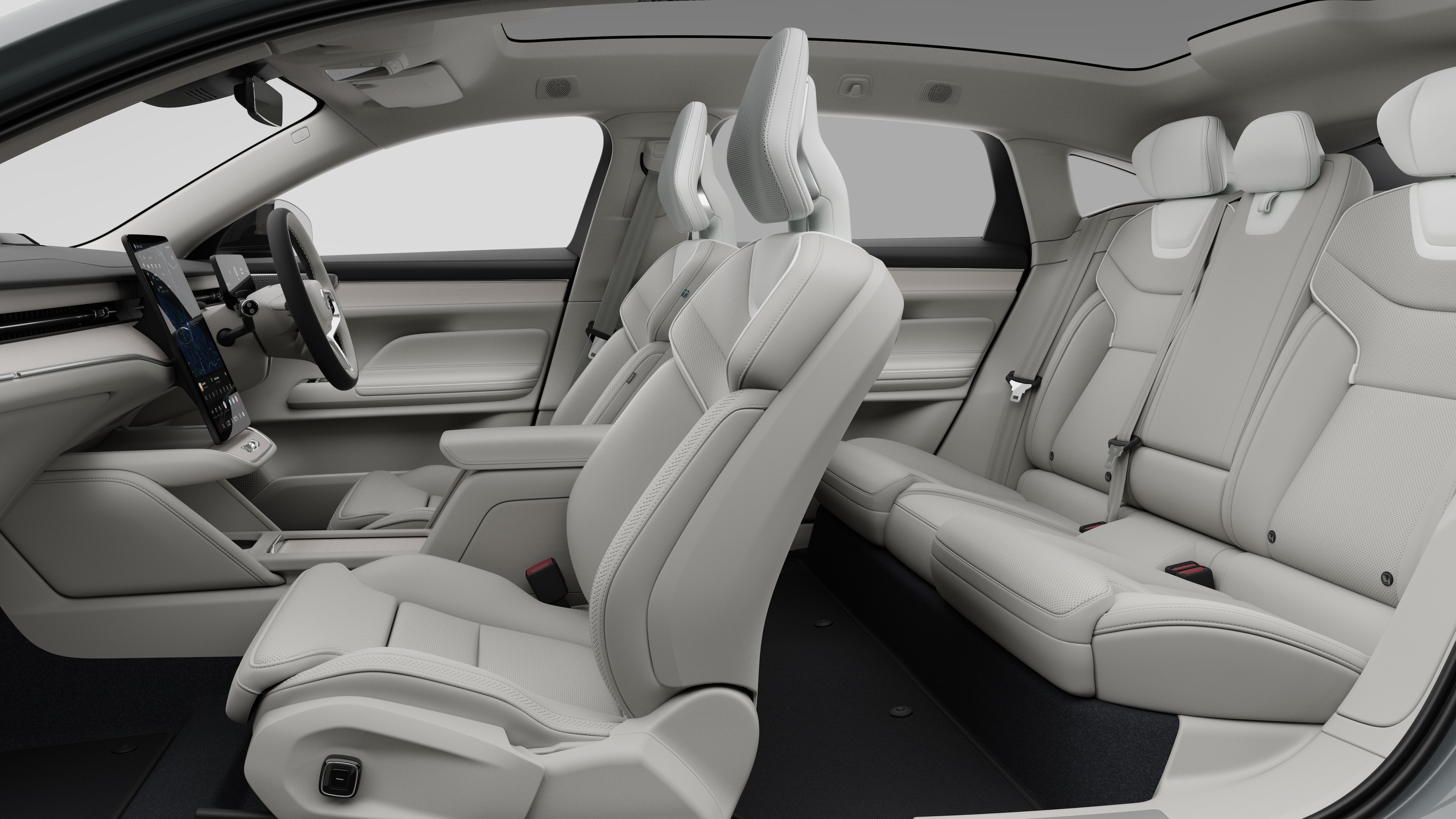 Volvo car interior side view showcasing front seats, rear passenger seats, steering wheel, dashboard, and centre console, set against plain studio background.