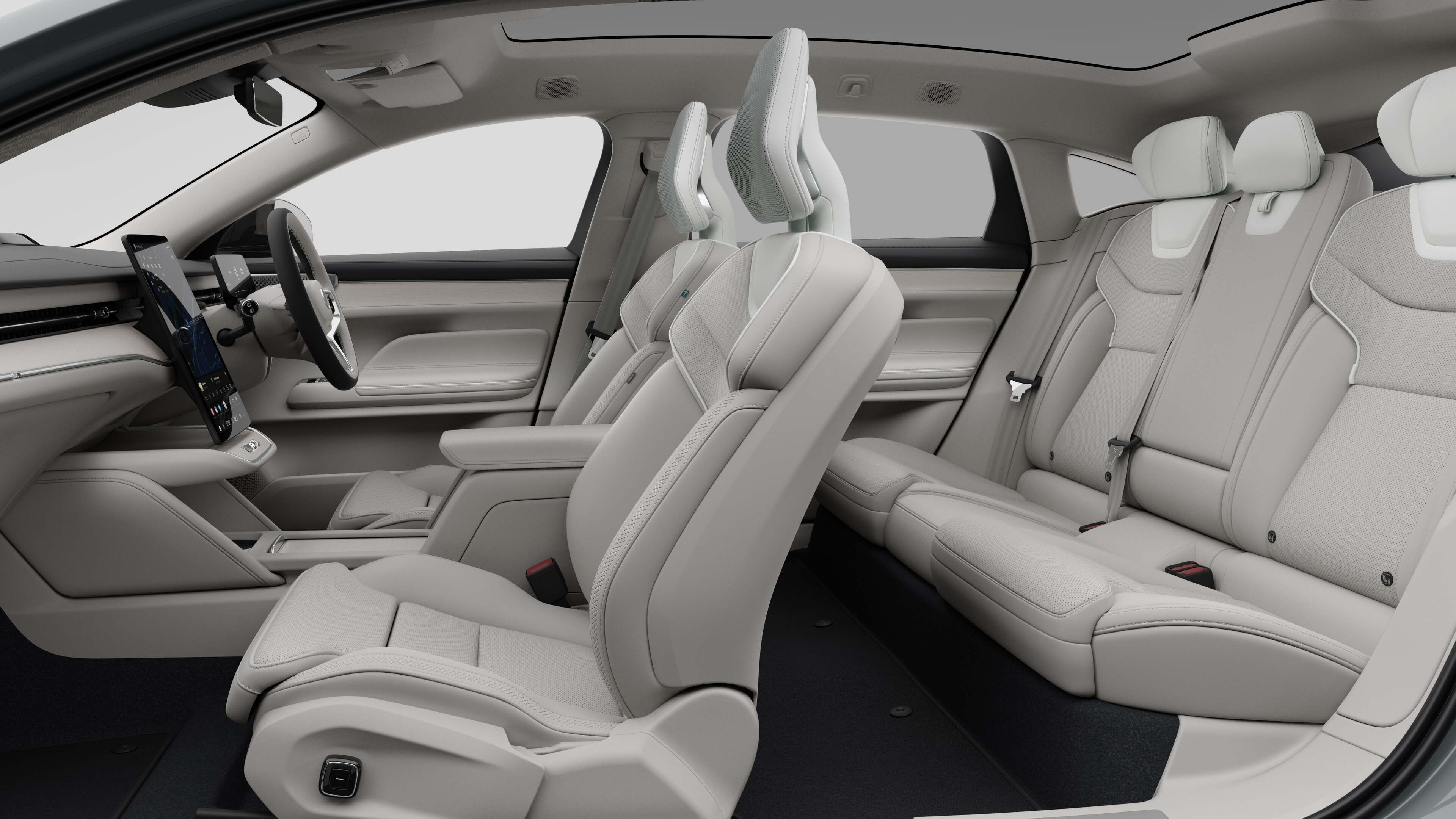 Volvo car interior side view showcasing front seats, rear passenger seats, steering wheel, dashboard, and center console, set against plain studio background.