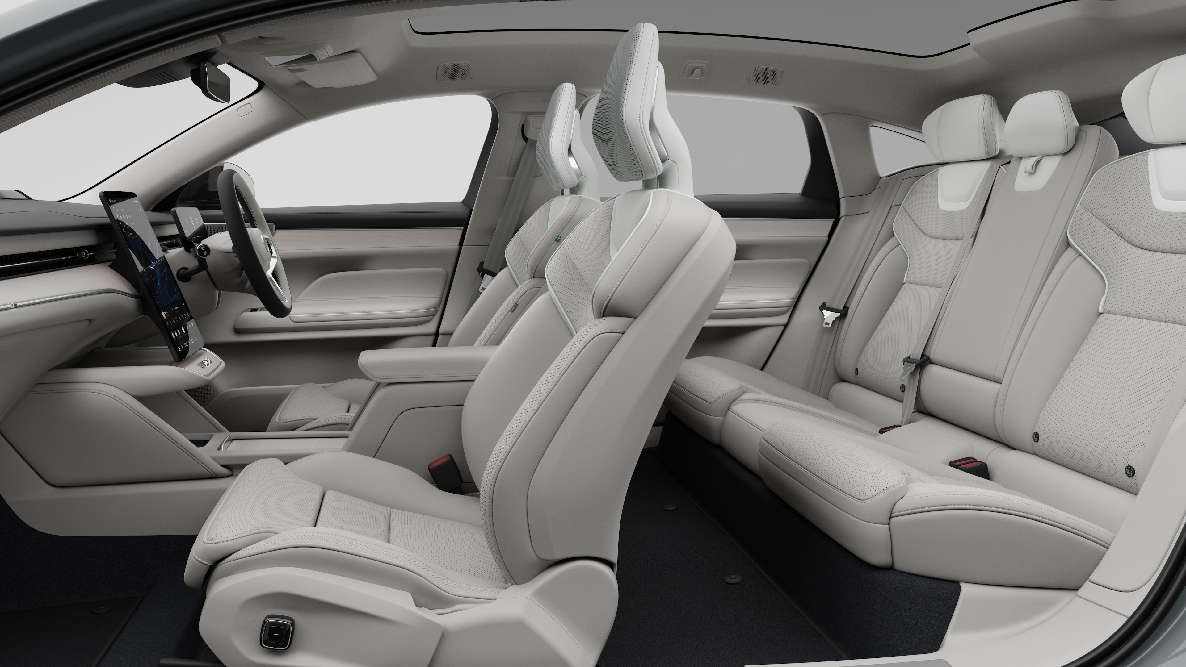 Volvo car interior side view showcasing front seats, rear passenger seats, steering wheel, dashboard, and center console, set against plain studio background.