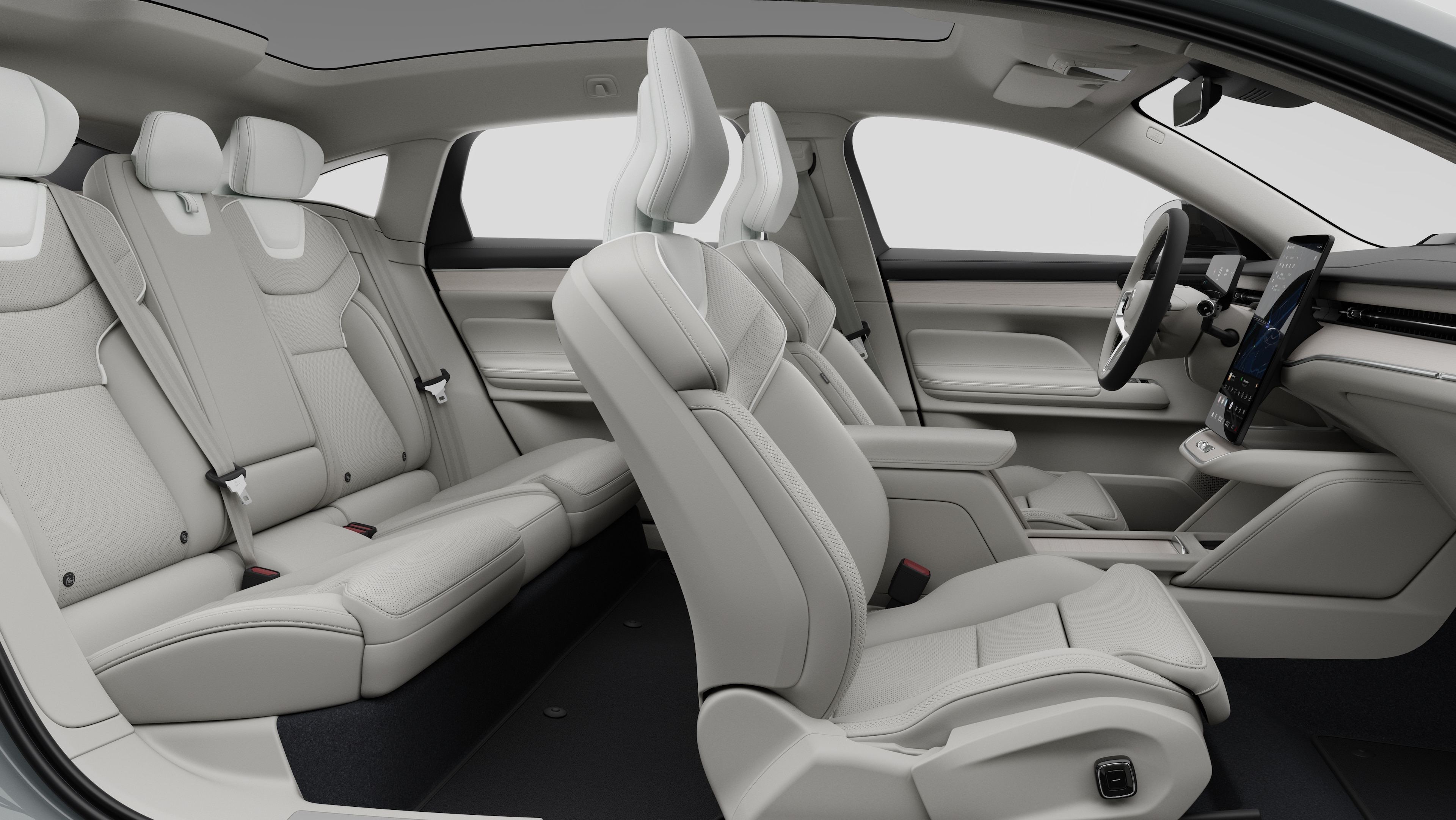 Zijaanzicht van het interieur van een Volvo met voorstoelen, passagiersstoelen achterin, stuurwiel, dashboard en middenconsole, tegen een effen studioachtergrond.