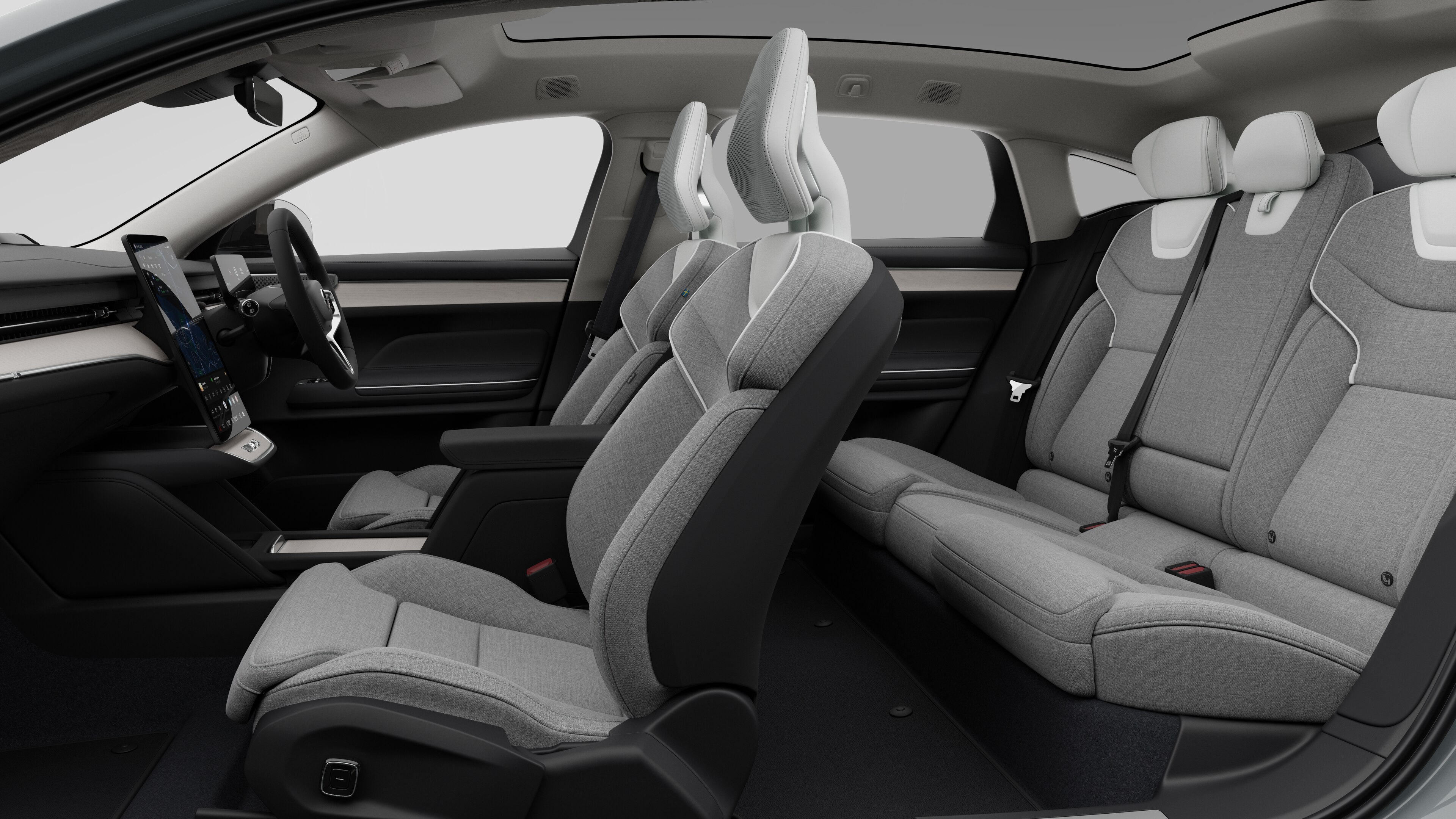 Volvo car interior side view showcasing front seats, rear passenger seats, steering wheel, dashboard, and centre console, set against plain studio background.