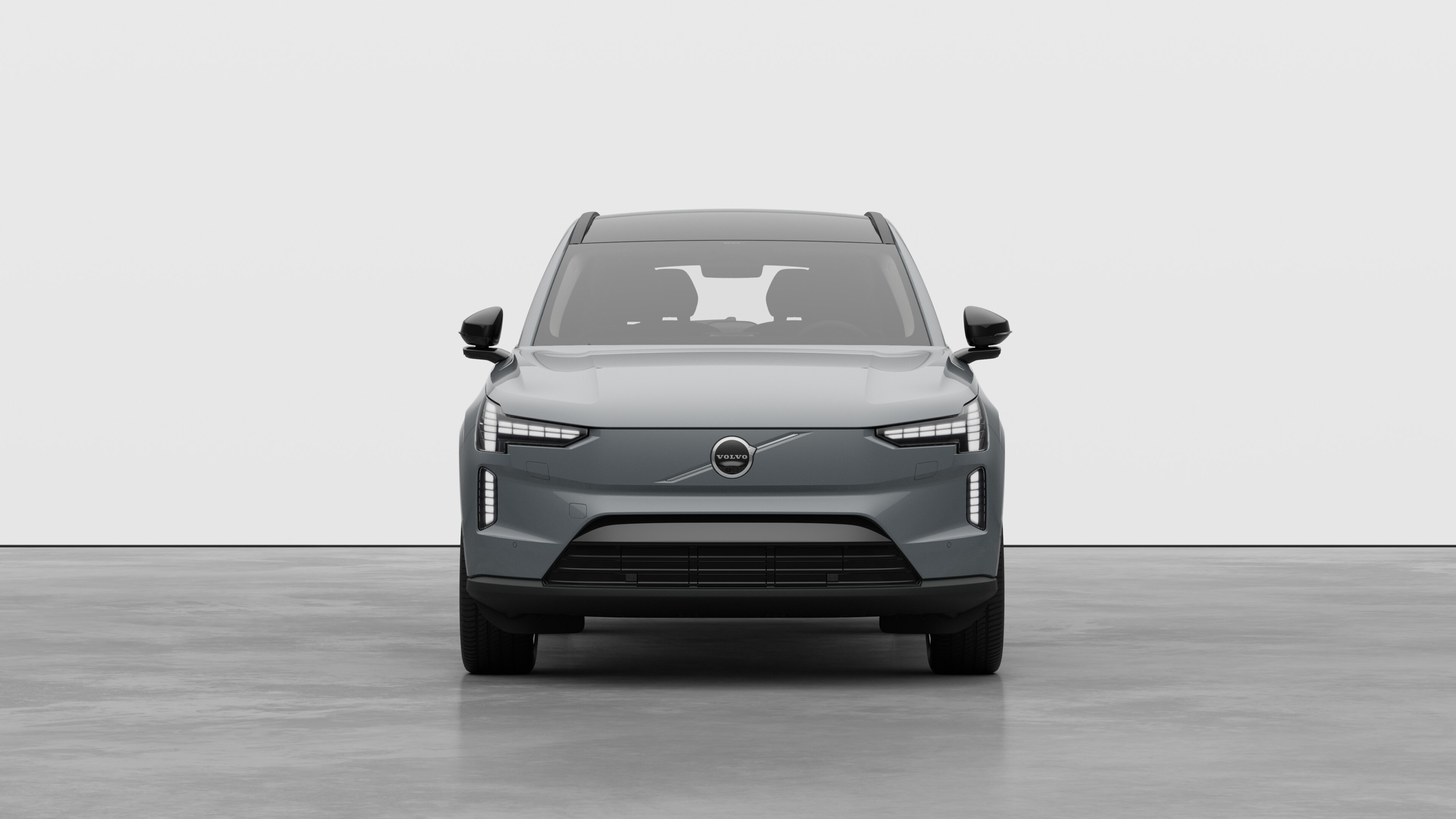 Widok samochodu Volvo z przodu na tle zwykłego studia