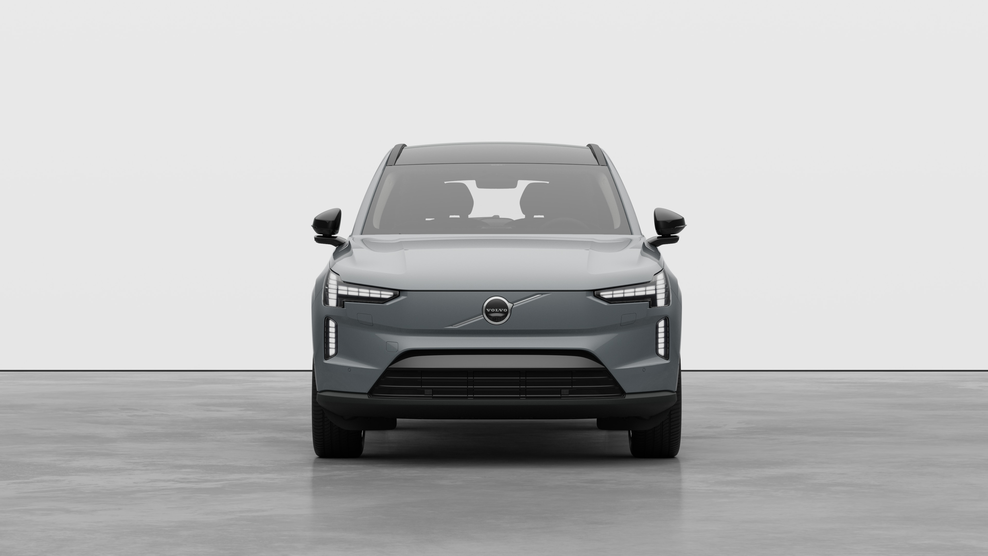 Widok samochodu Volvo z przodu na tle zwykłego studia