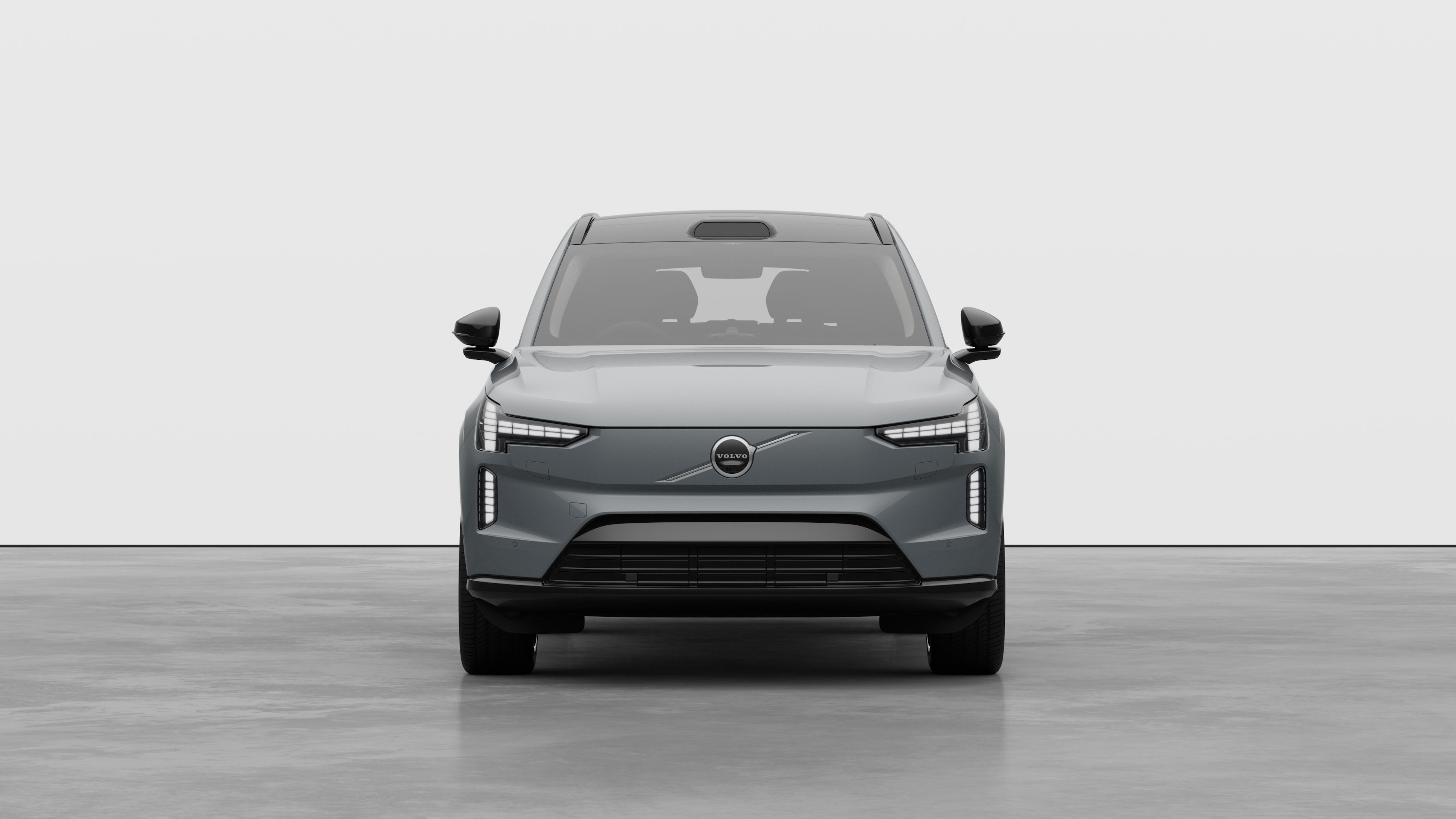 Front view of a Volvo car in a plain studio background.