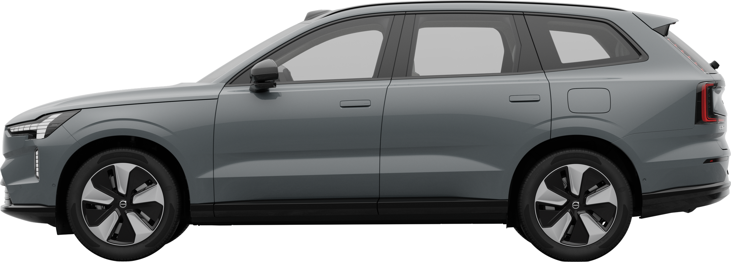 En Volvo sett fra siden parkert mot en vanlig studiobakgrunn, som viser bilens elegante profil og design.