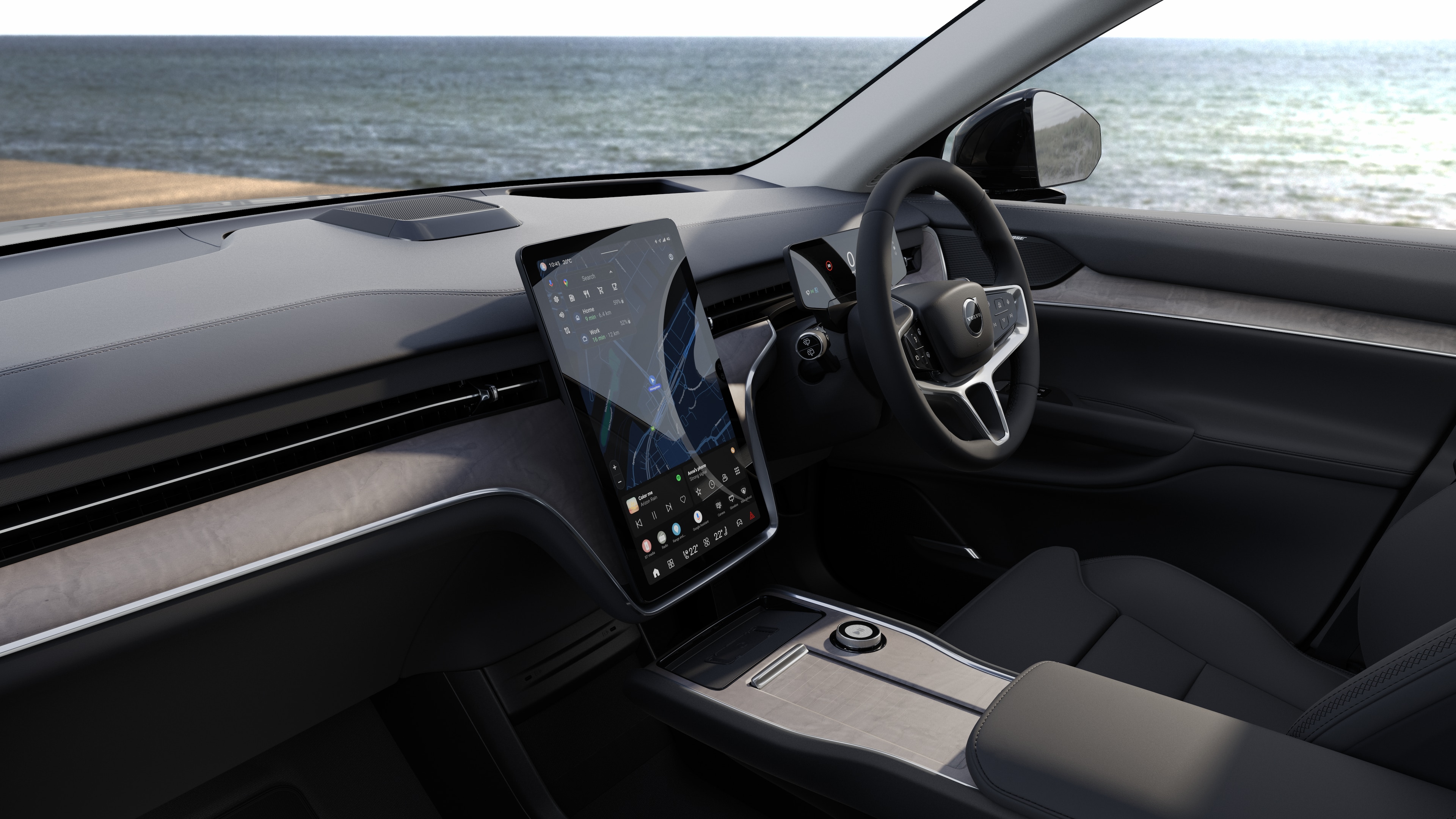 Volvo car interior showing dashboard, steering wheel, and center console with digital display in an open road background.