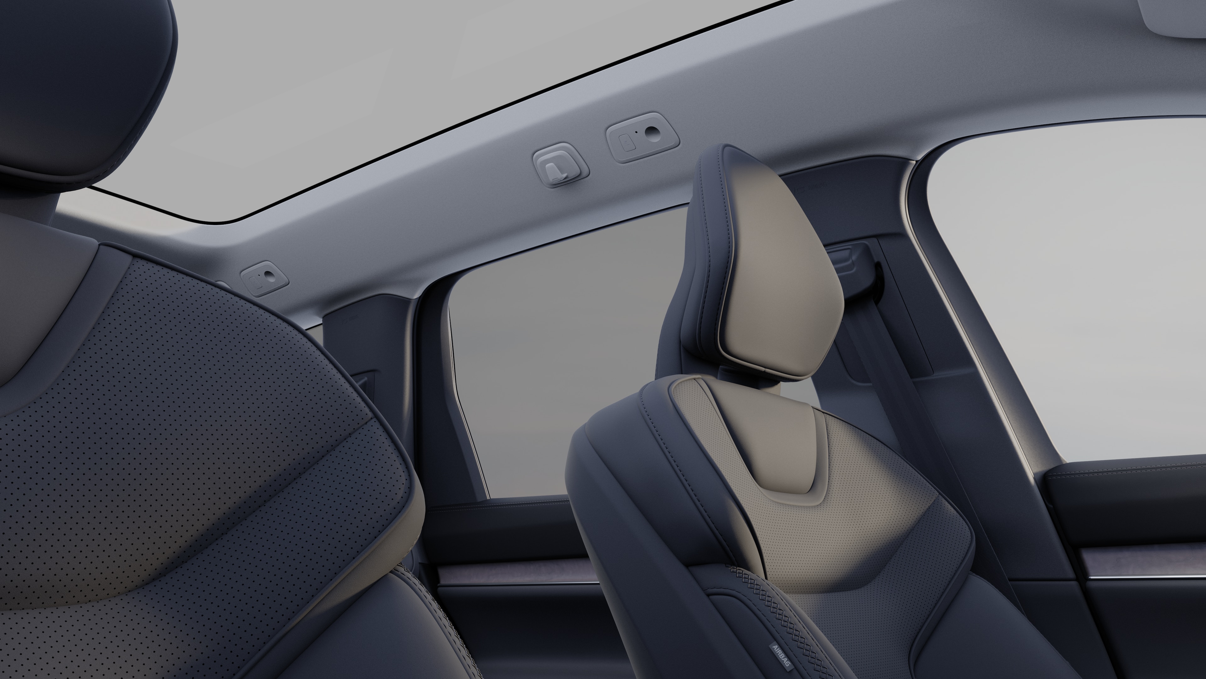 Innenraum eines Volvo mit Beifahrer- und Rücksitzen, Lenkrad, Armaturenbrett und Mittelkonsole vor einem schlichten Studiohintergrund.