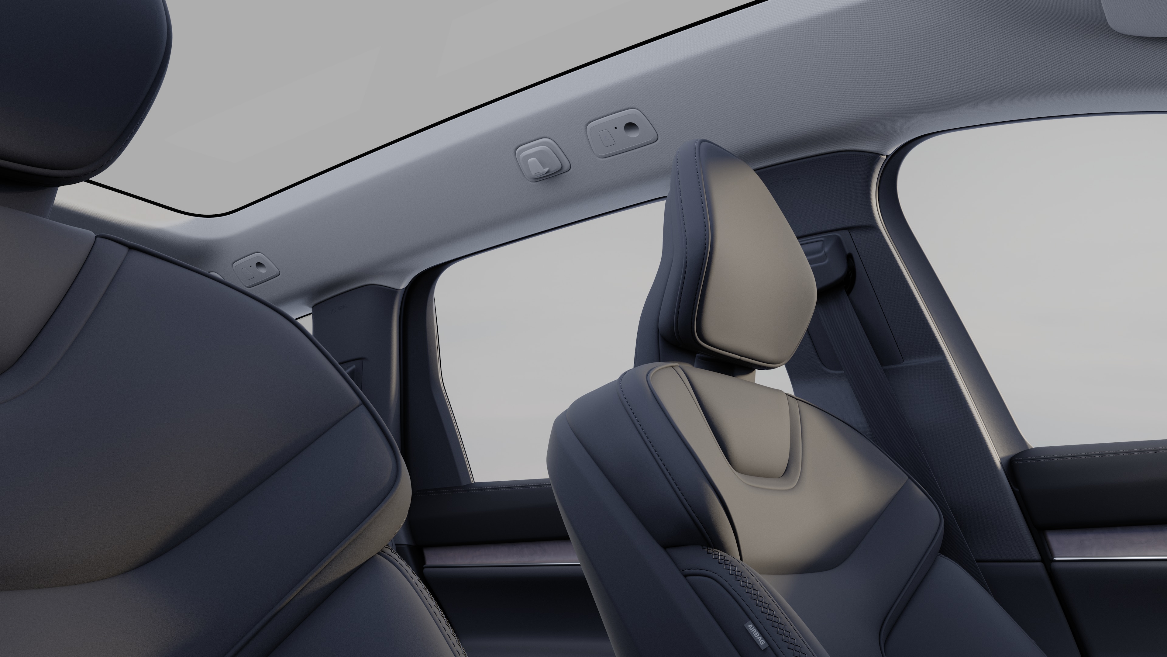 Volvo car interior showing front and rear passenger seats, steering wheel, dashboard, and center console against a plain studio background.