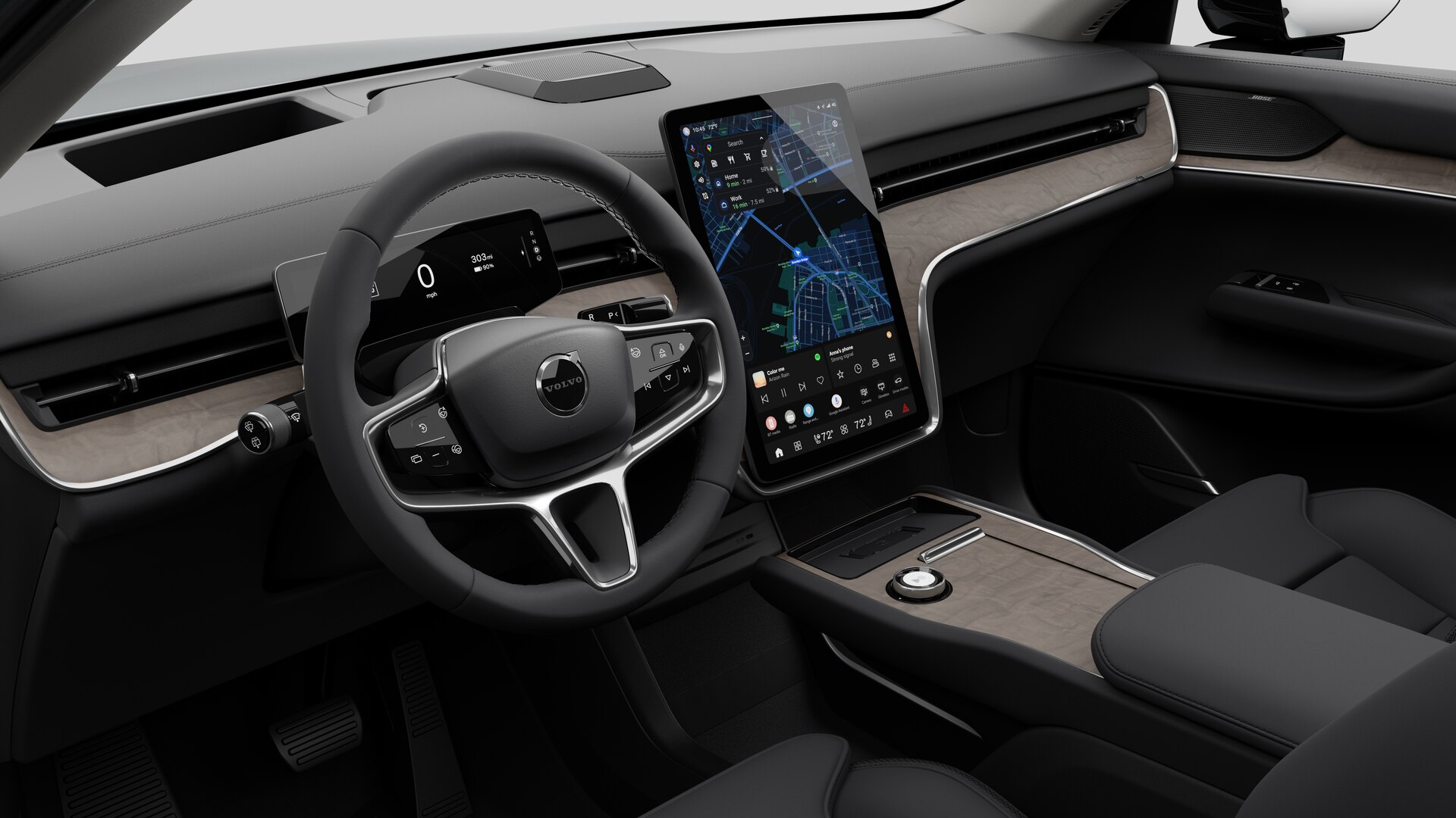 Interior view of a Volvo car showing the dashboard, steering wheel, center console, and digital display screen in a plain studio background.