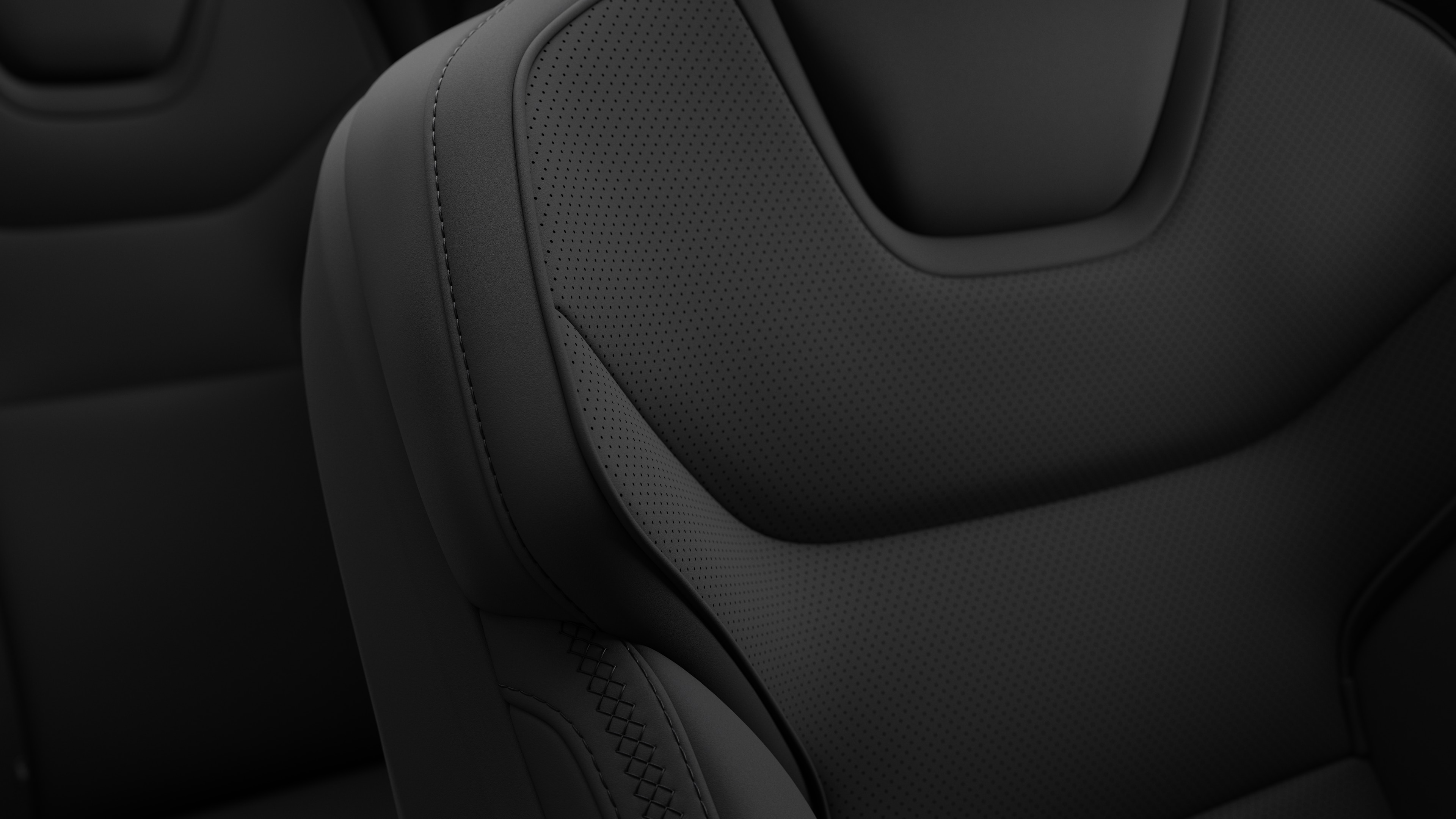 Close-up of Volvo car interior seat detail showing stitching and a small Swedish flag tag.