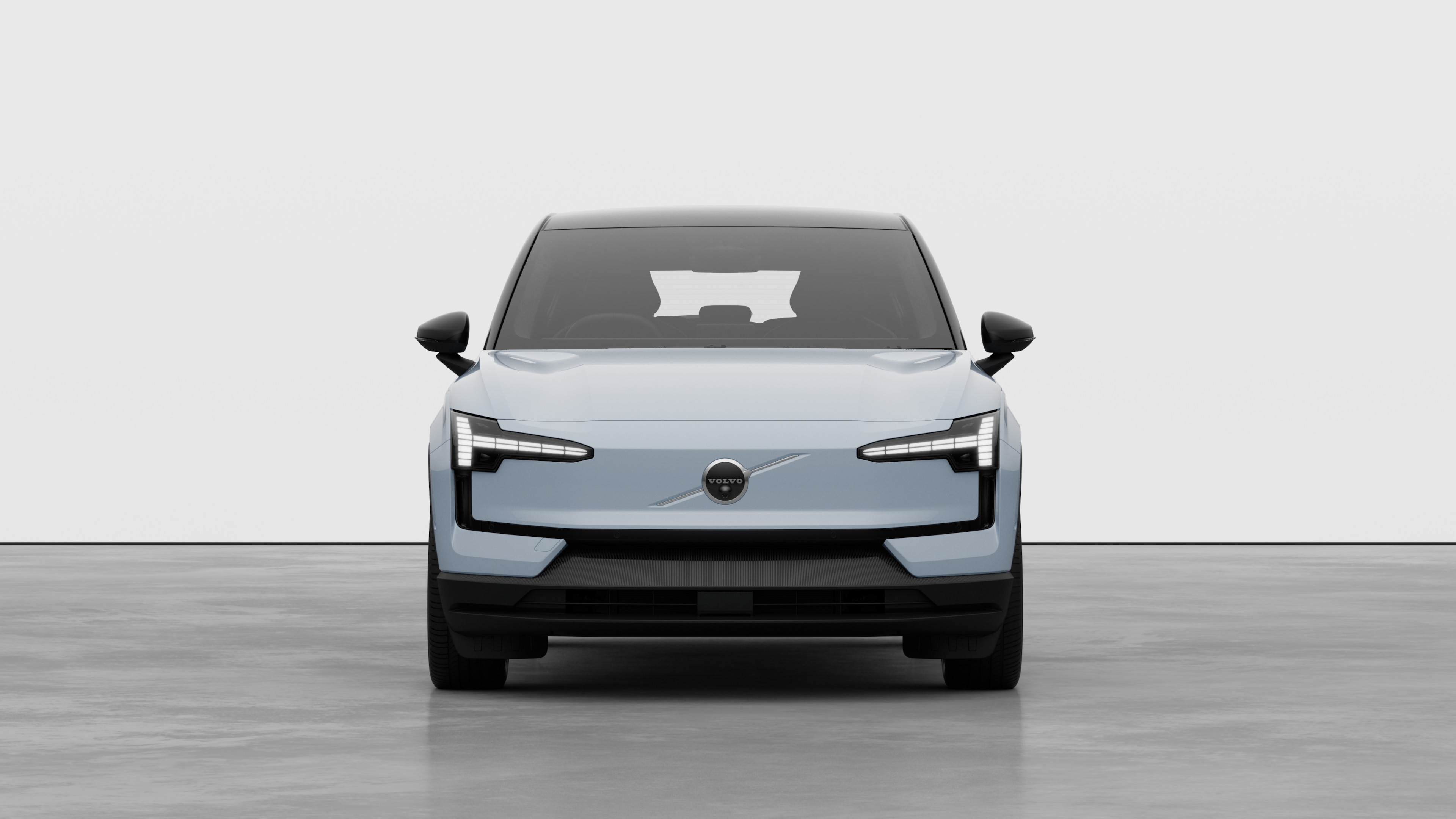 無地のスタジオを背景にしたボルボ車のフロントビュー。