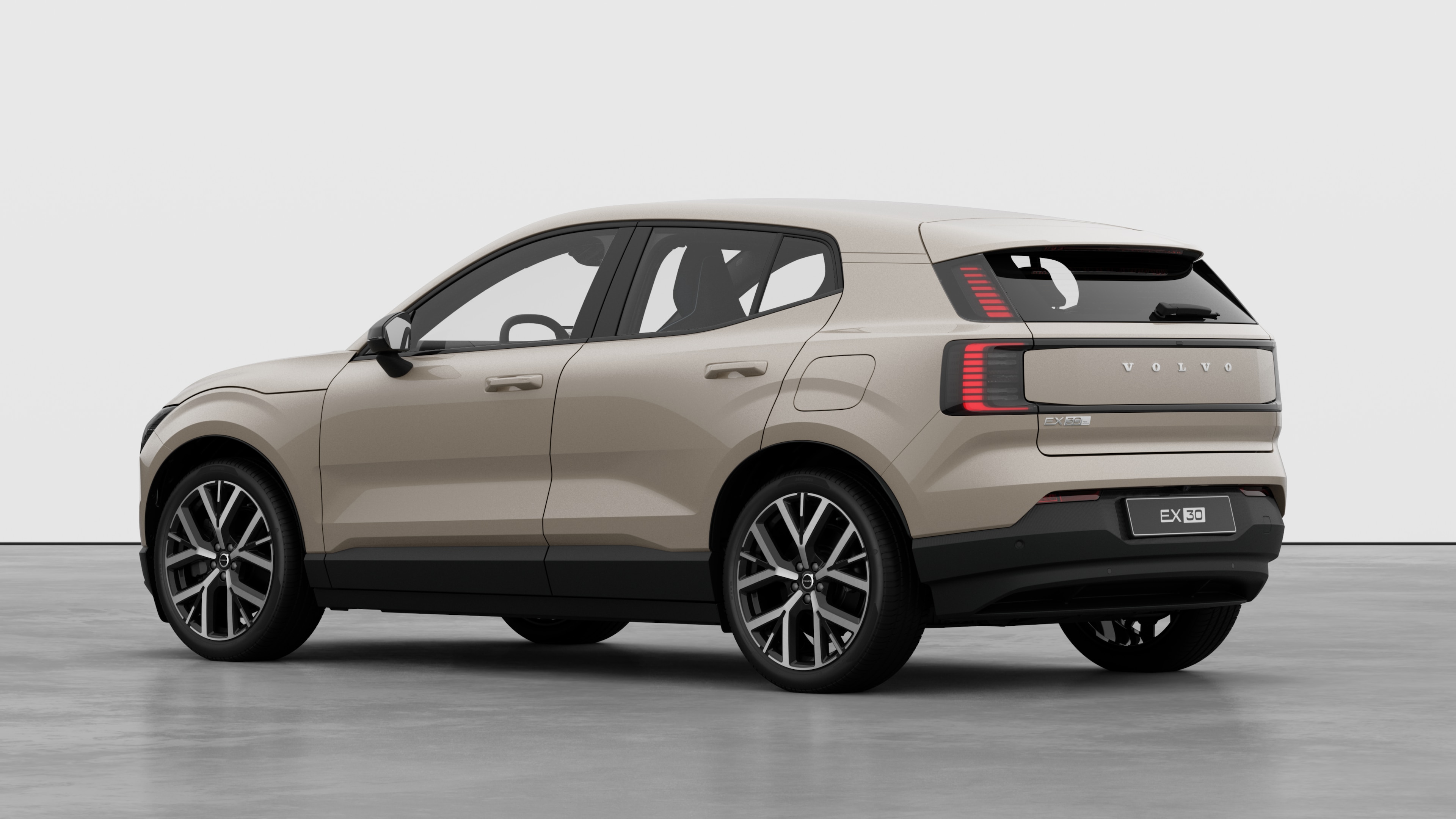 Volvo car rear three-quarter view in a plain studio background.