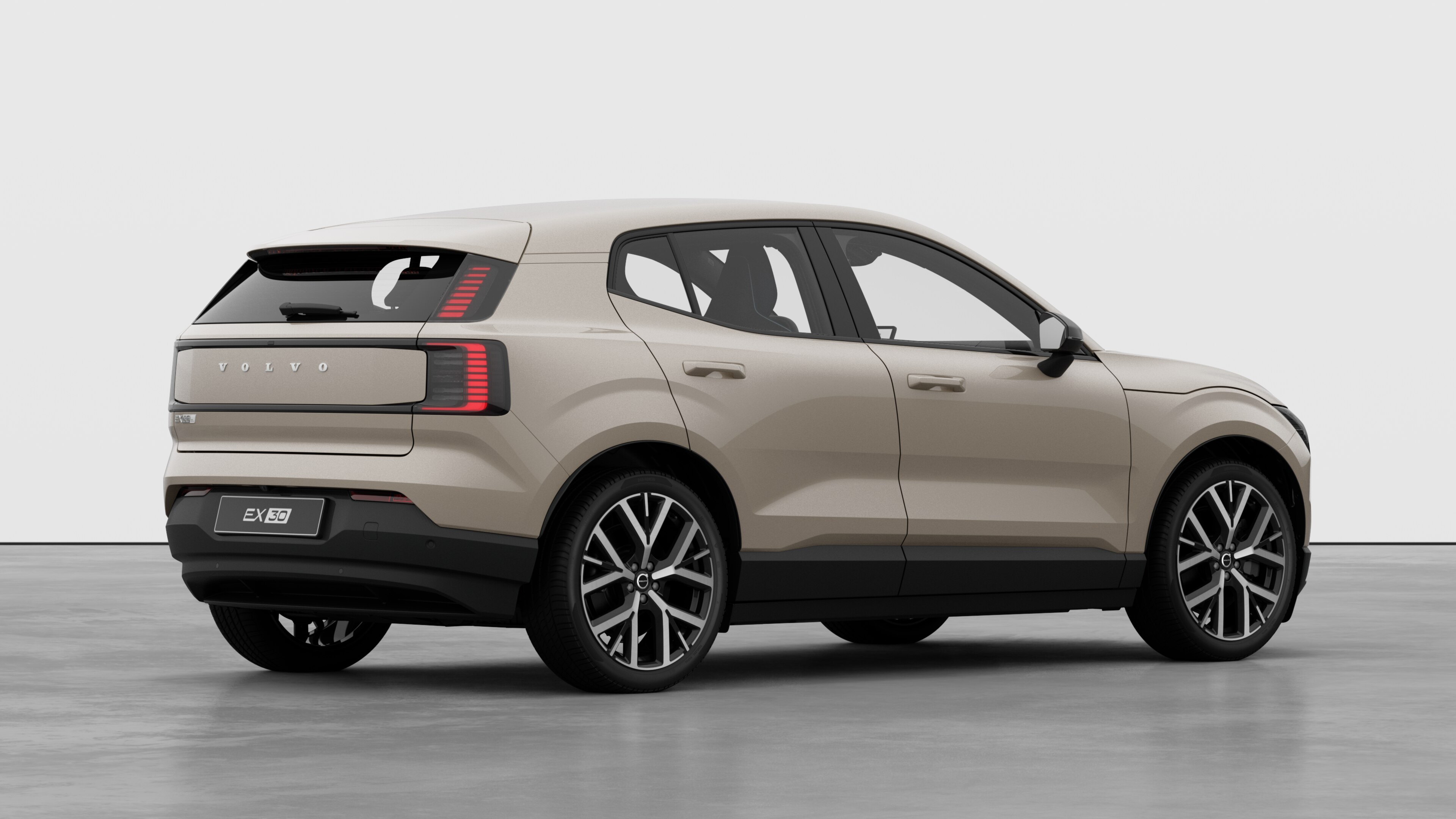 Volvo car rear three-quarter view on plain studio background.